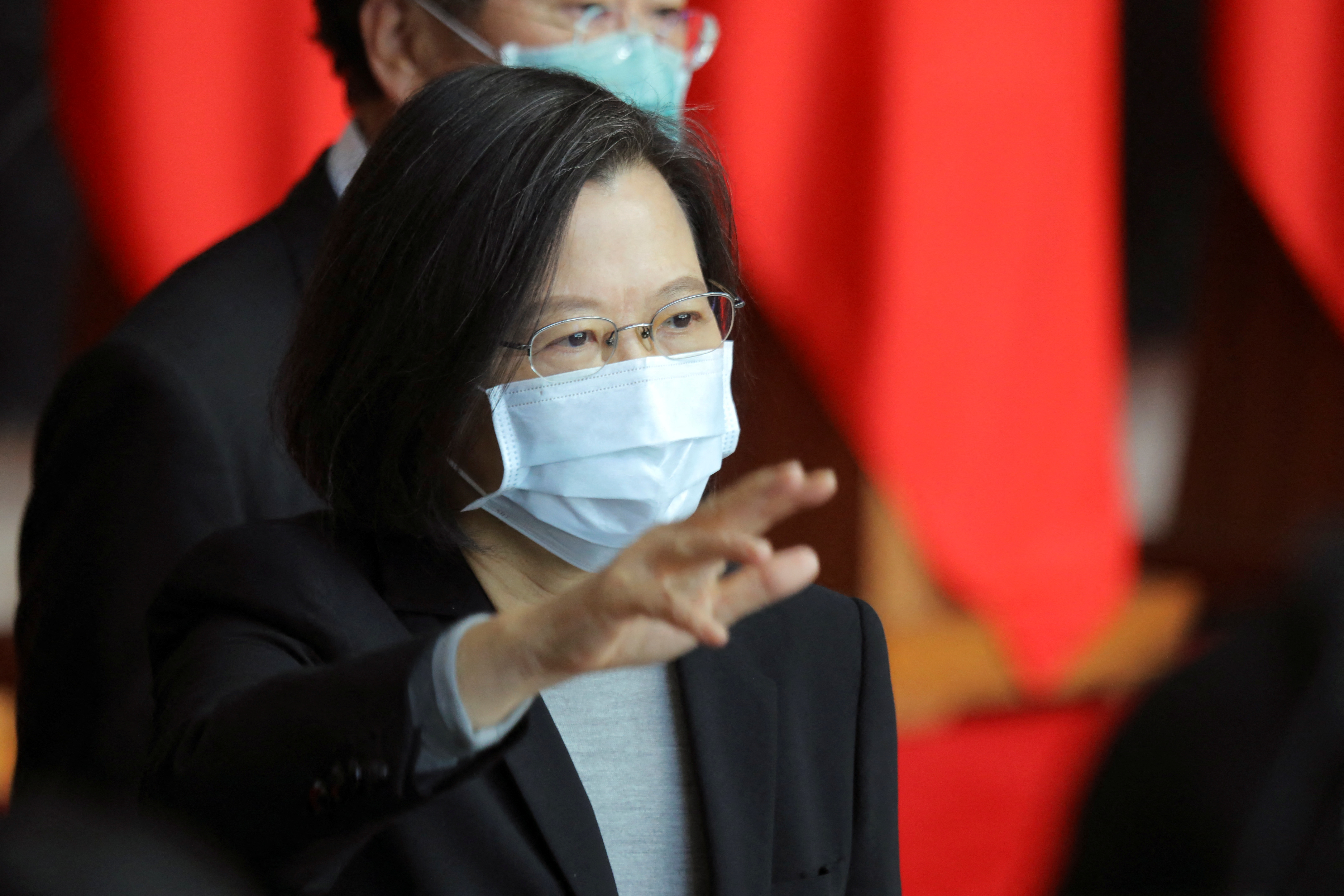 Taiwan President Tsai Ing-wen waves at the end of a rank conferral ceremony for military officials, in Taipei