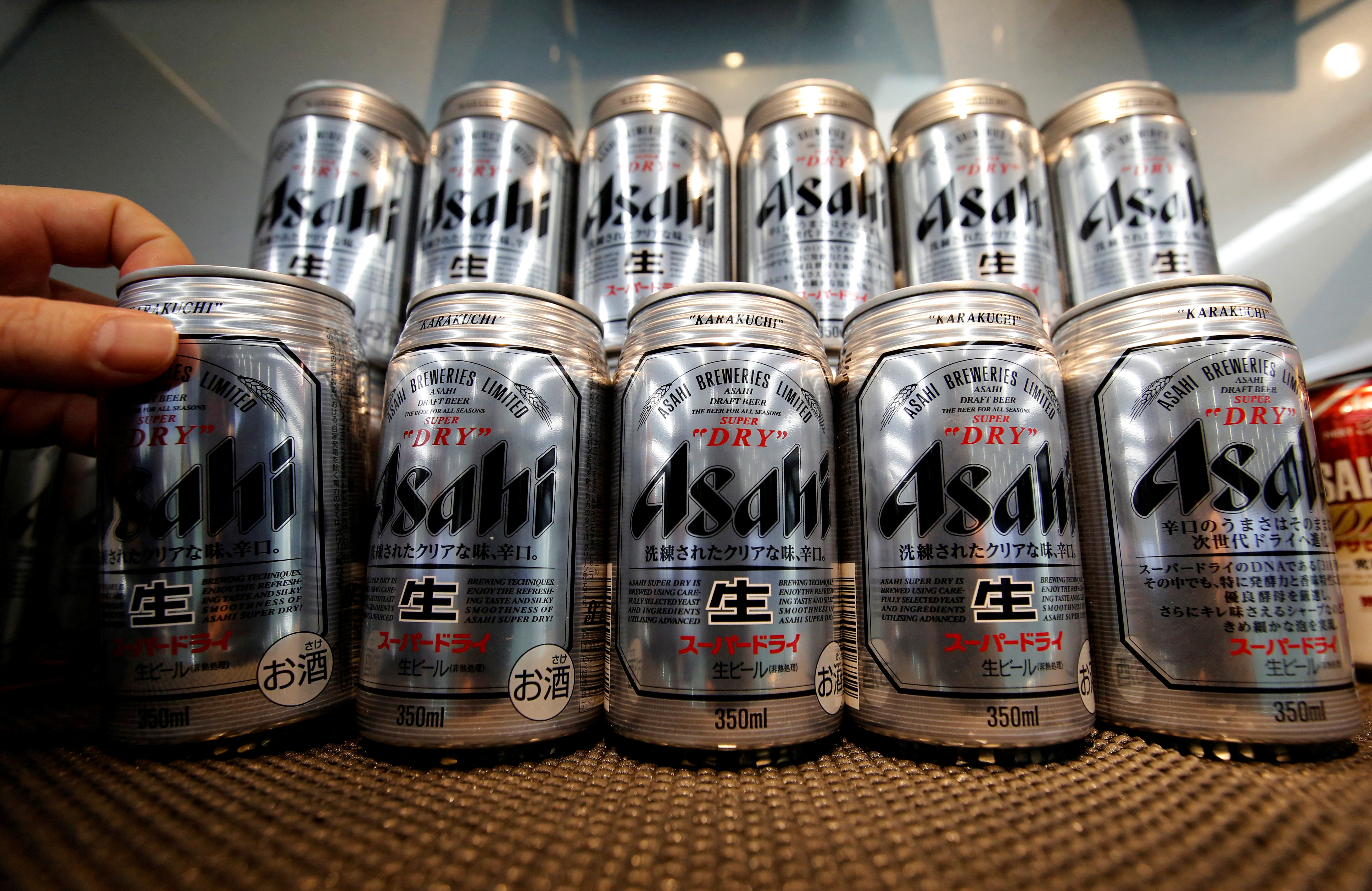 Asahi Super Dry beer cans are displayed at the Asahi Group Holdings headquarters in Tokyo