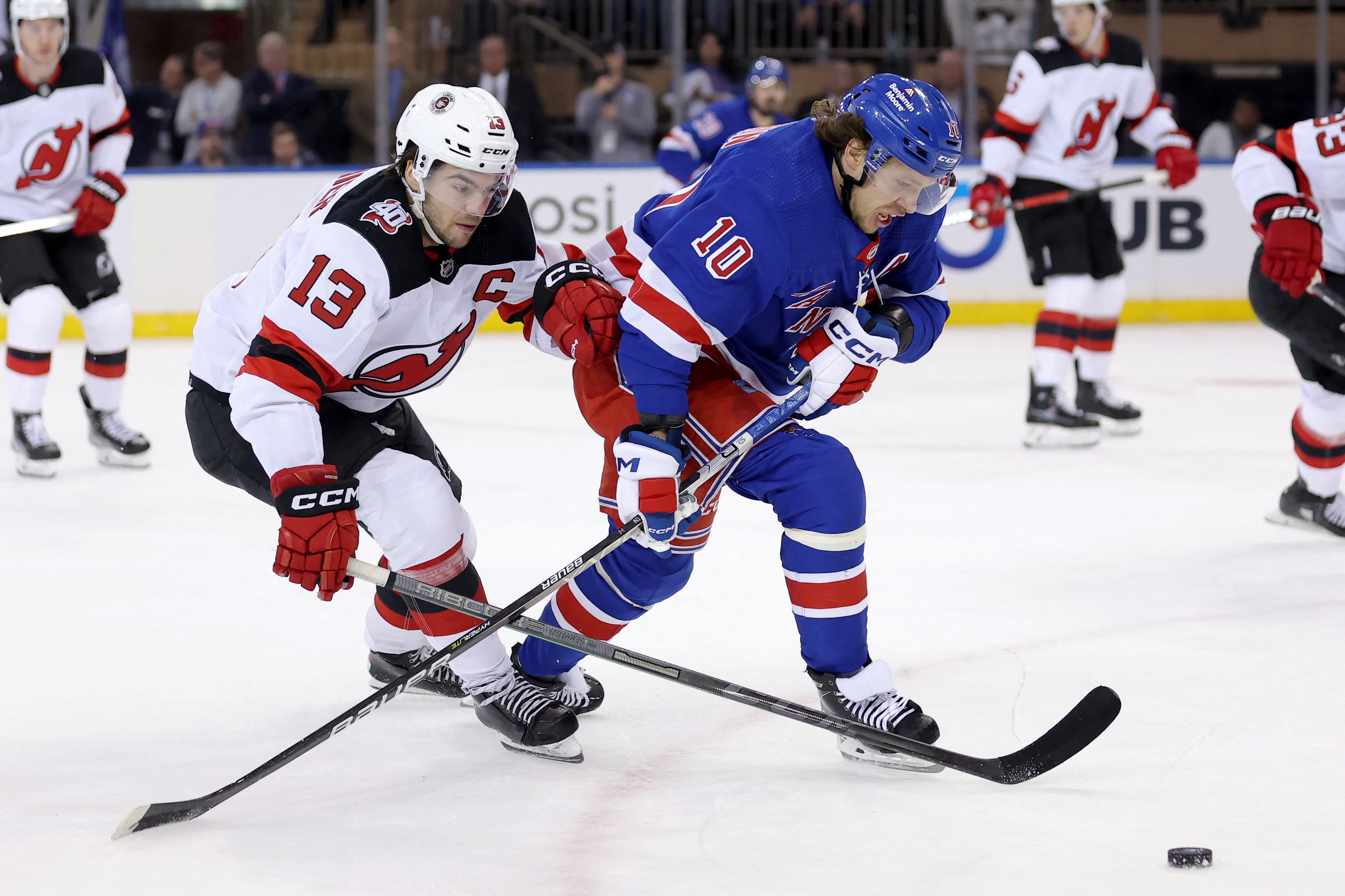 New Jersey Devils' Ondrej Palat (18) skates past the New York Rangers'  bench after scoring a goal during the first period of Game 5 of an NHL  hockey Stanley Cup first-round playoff