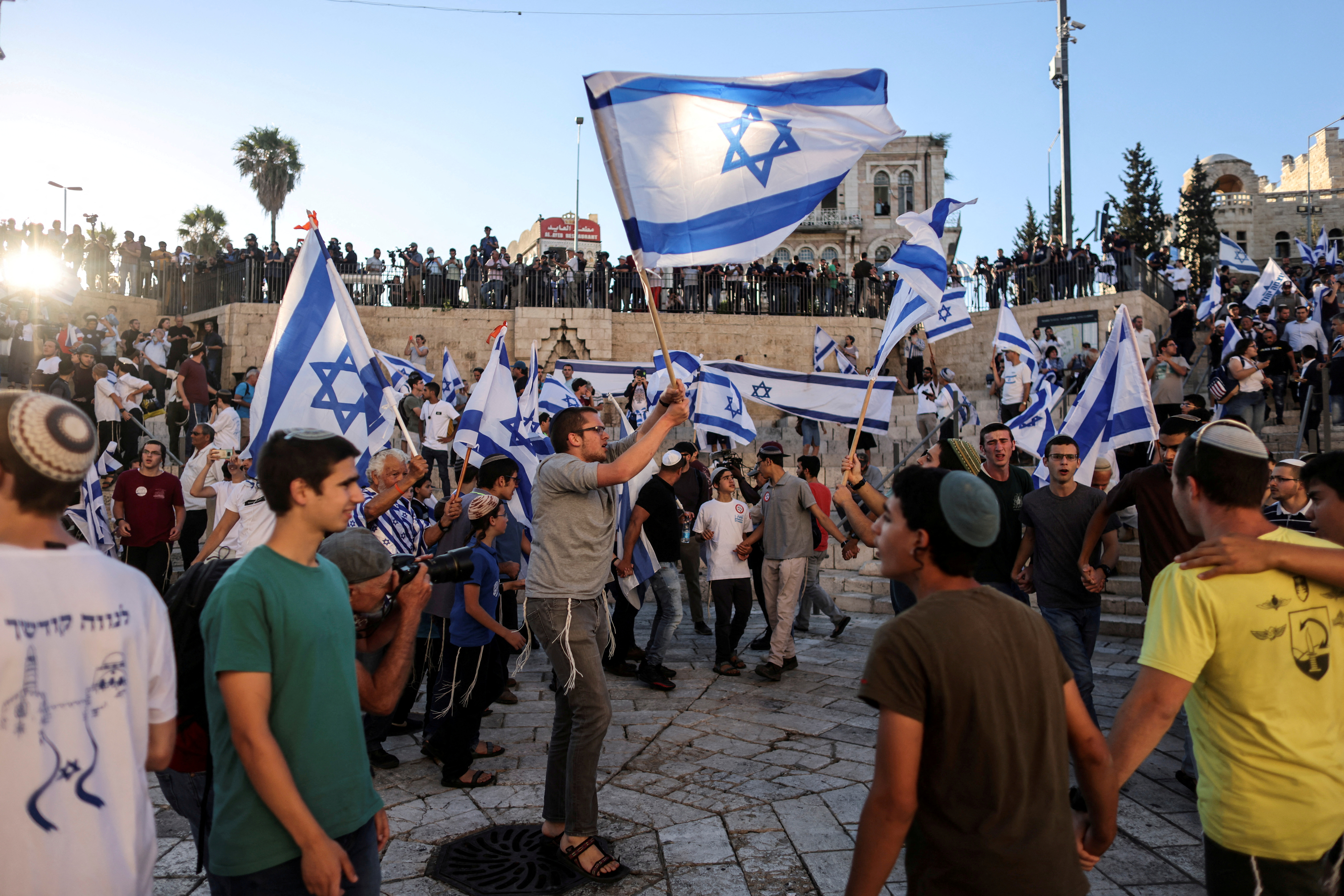 Israelis dance with flags by Damascus gate just outside Jerusalem's Old City