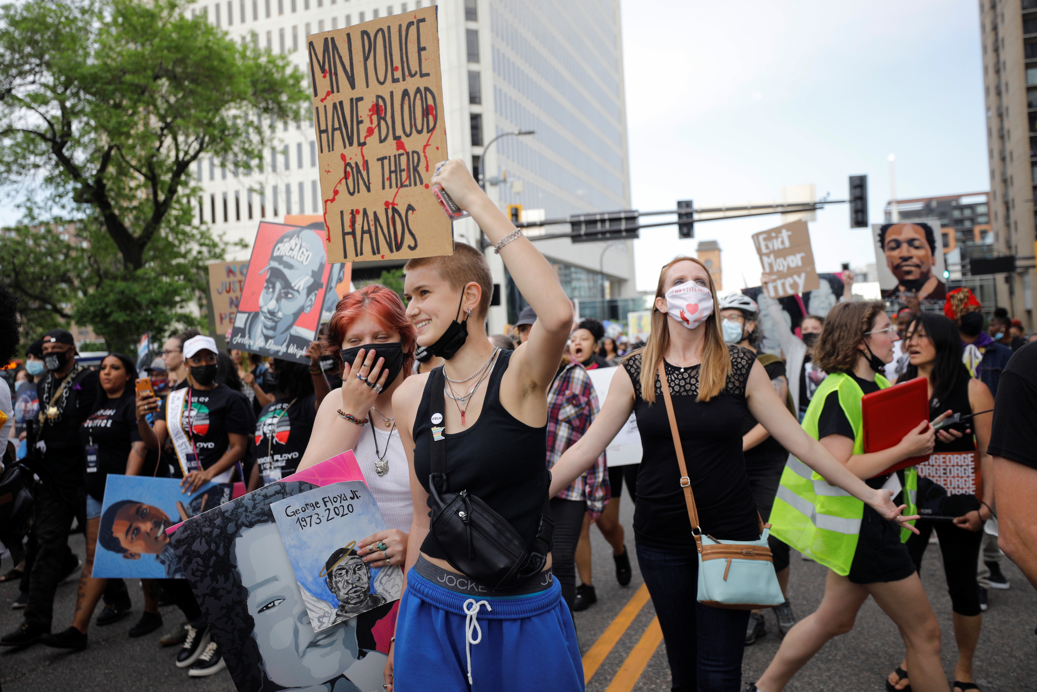 People march during the "One Year, What's Changed?" rally hosted by the George Floyd Global Memorial to commemorate the first anniversary of his death, in Minneapolis, Minnesota, U.S. May 23, 2021. REUTERS/Nicholas Pfosi