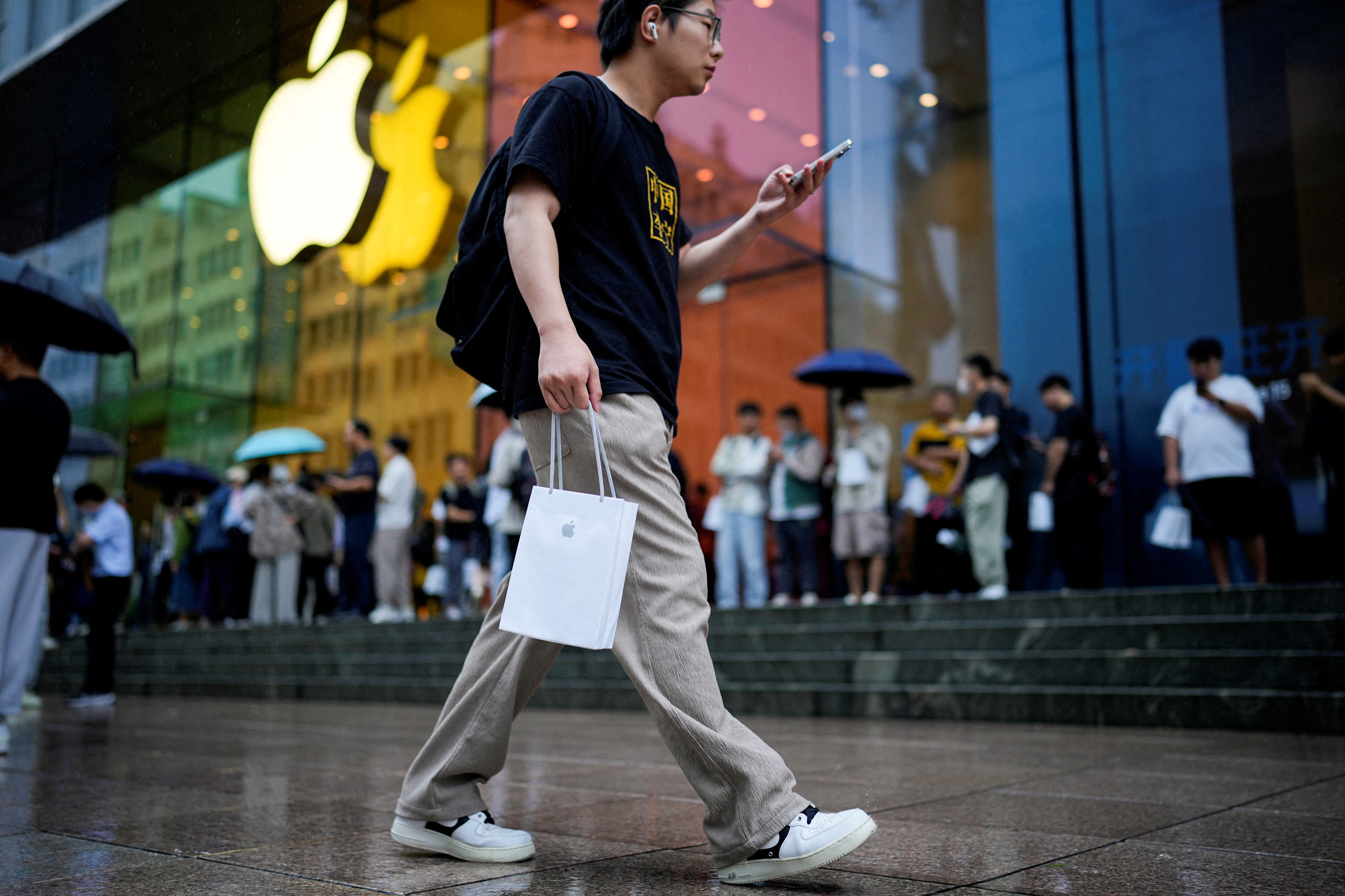 Man carrying Apple's iPhone 15 in a bag in Shanghai, China