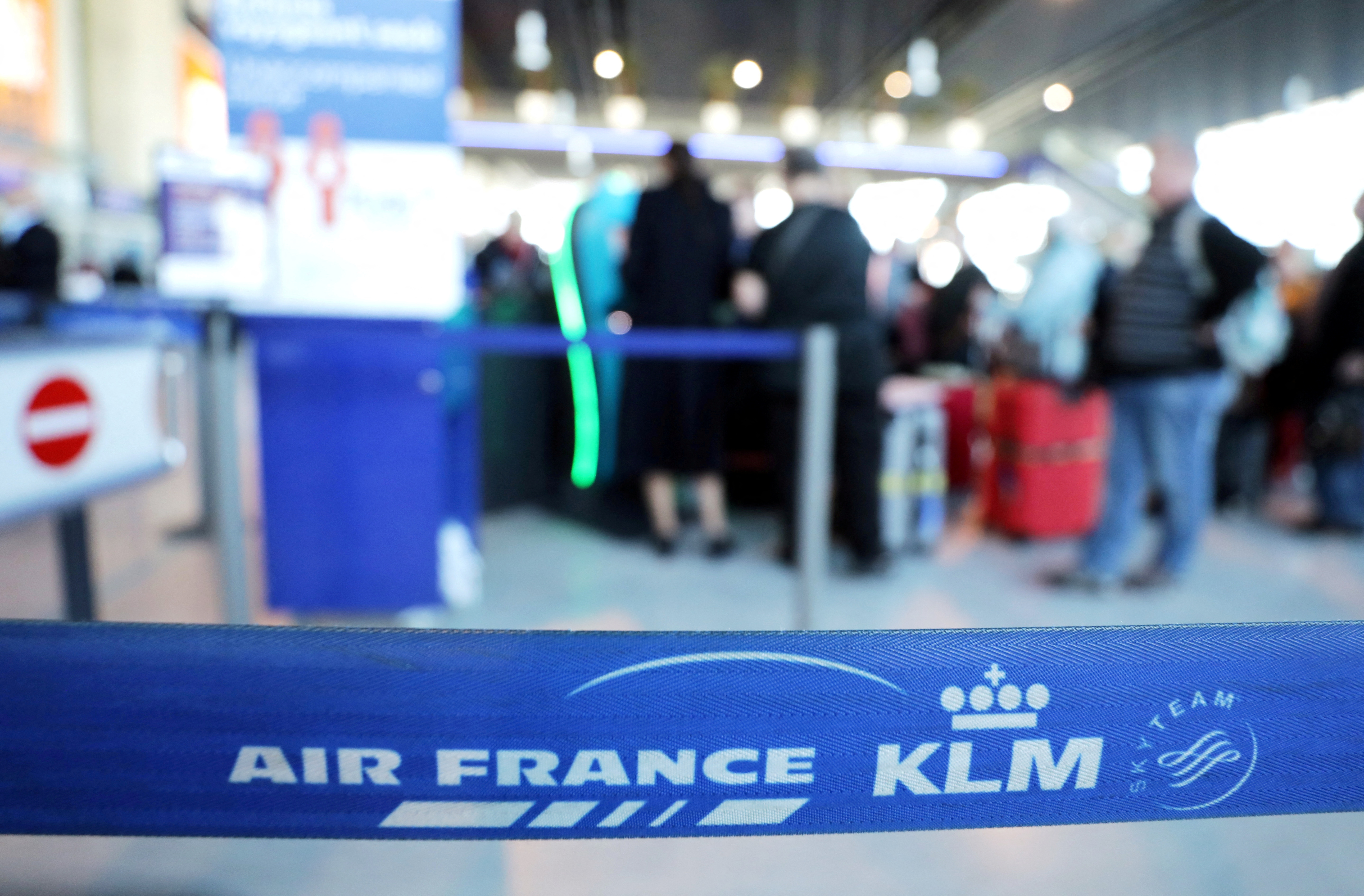 Passengers wait at the Air France desk at Nice international airport