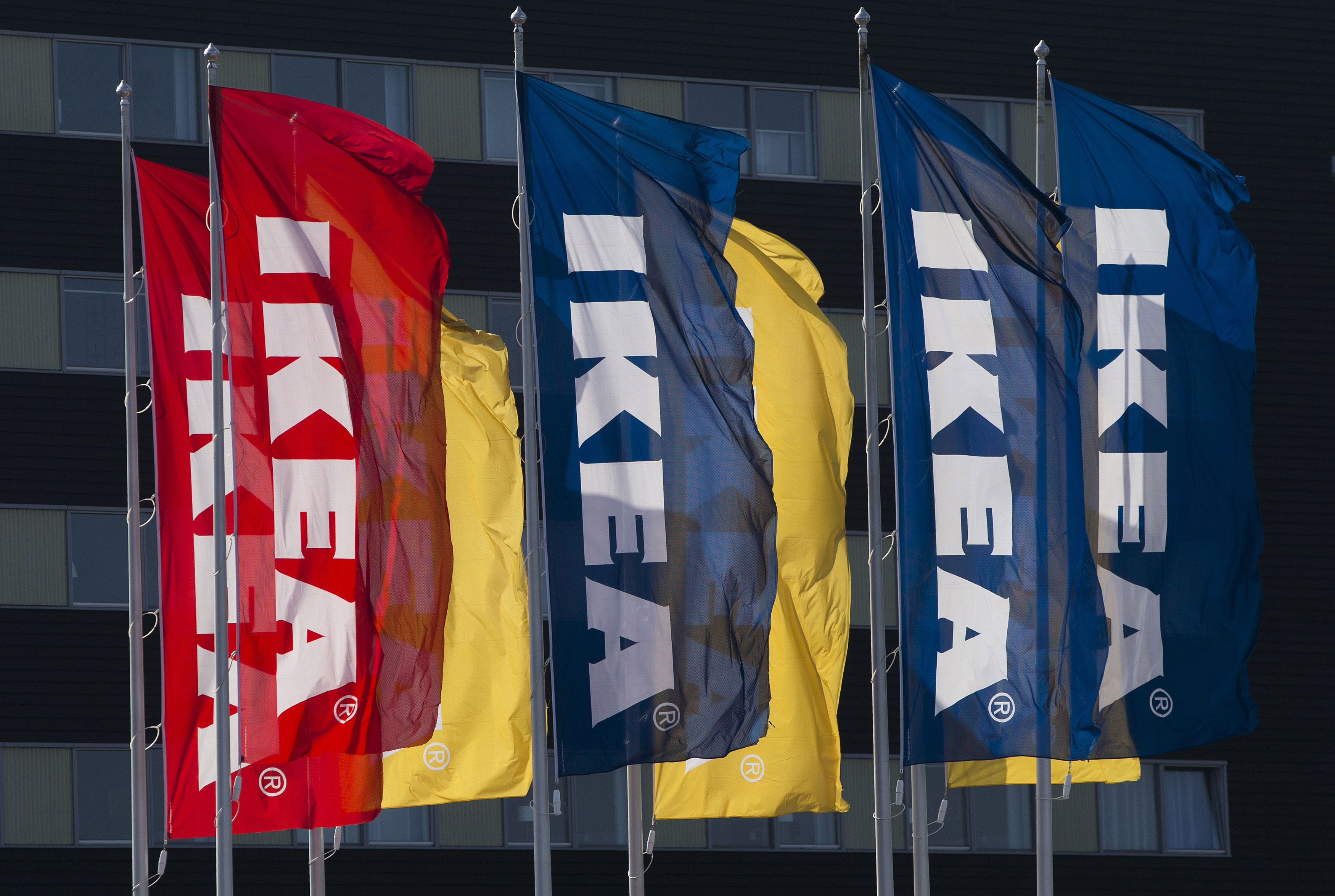 The IKEA logo is seen on flags outside the IKEA Concept Center in Delft