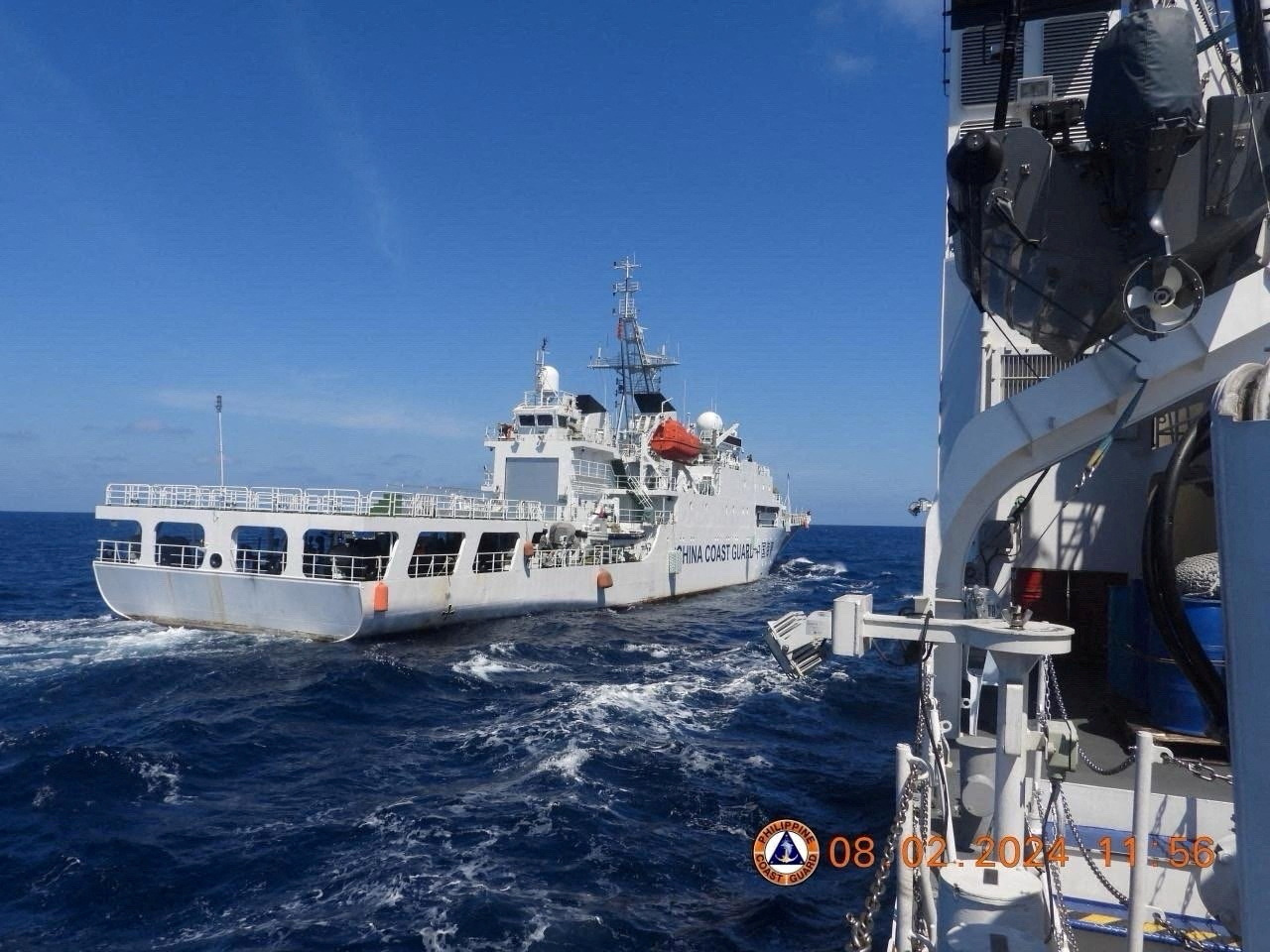 A China Coast Guard vessel manoeuvres near Philippine Coast Guard vessel BRP Teresa Magbanua near Scarborough Shoal in the South China Sea