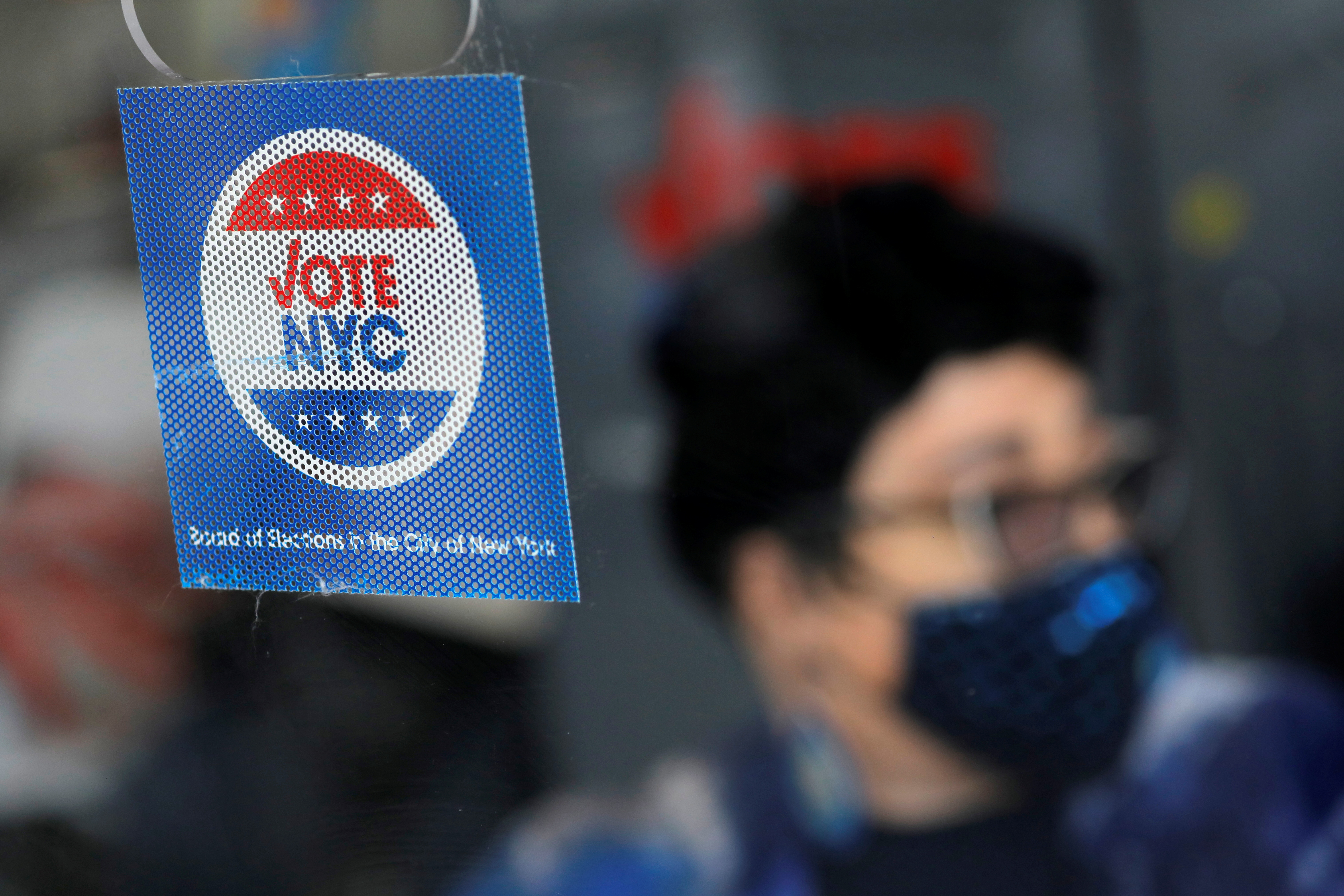 Signage is seen at an early voting location ahead of the New York City mayoral election in Harlem, New York City