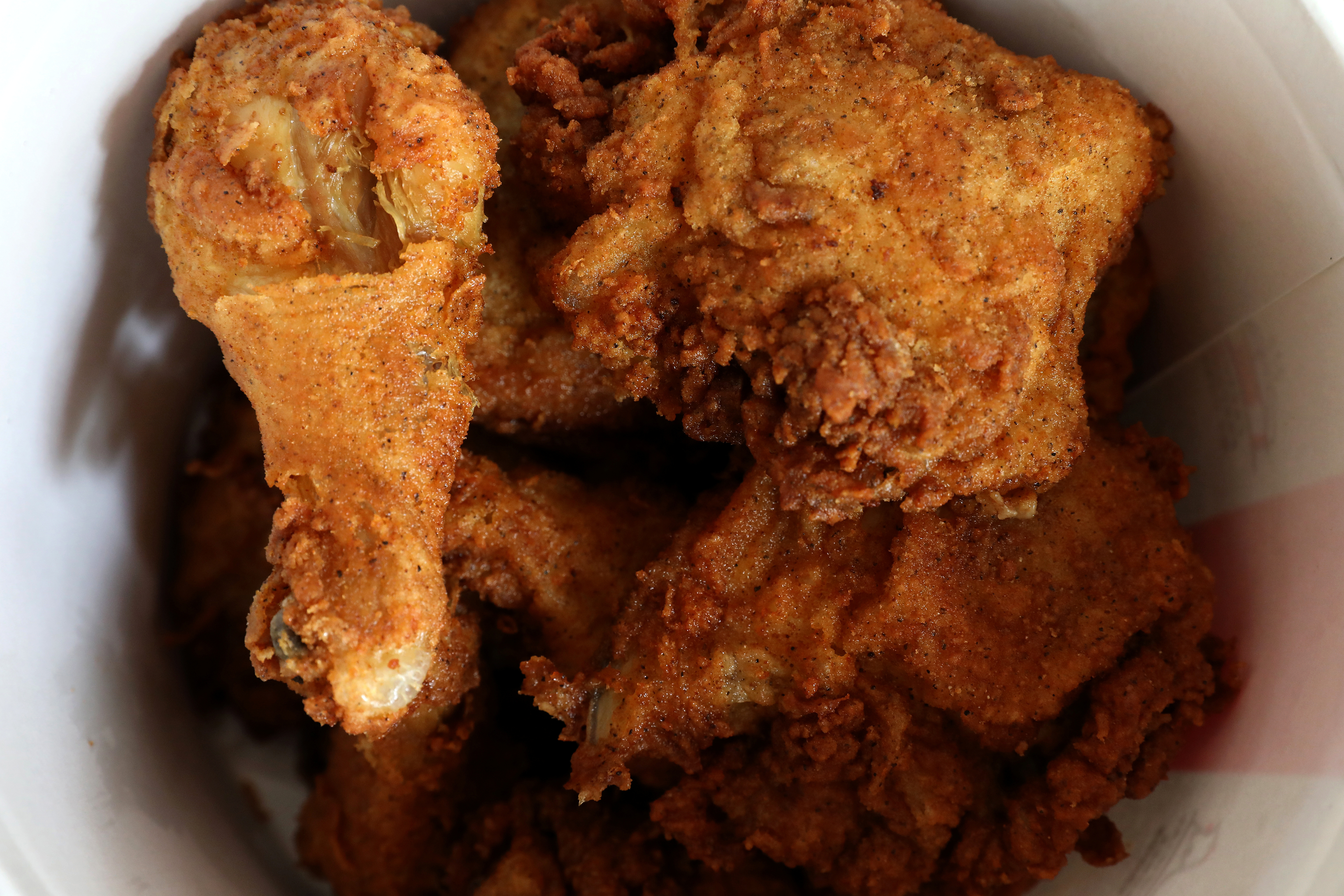 A Kentucky Fried Chicken (KFC) bucket of fried chicken is seen in this picture illustration