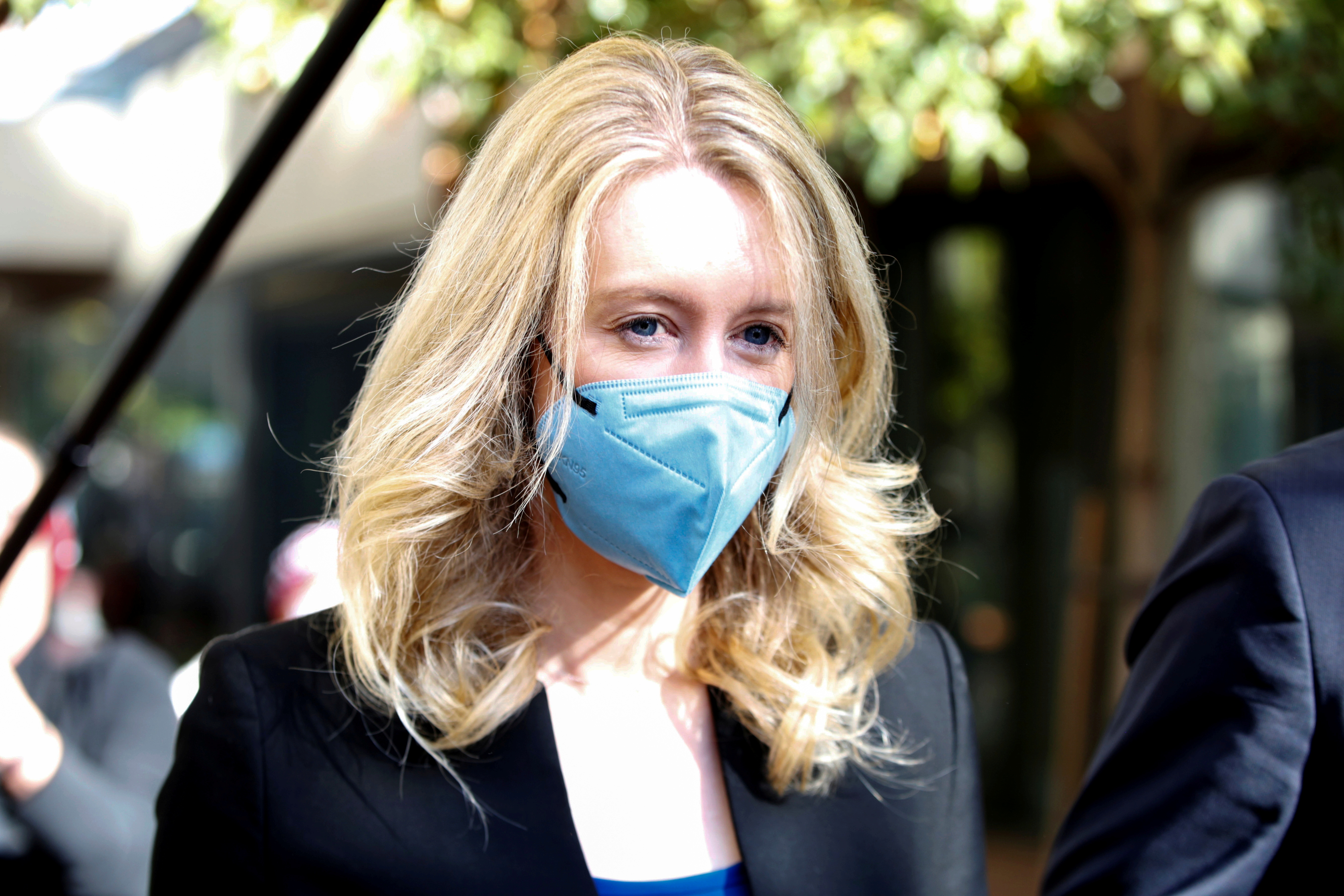 Theranos founder Elizabeth Holmes leaves after attending her fraud trial at federal court in San Jose, California, U.S. November 22, 2021.  REUTERS/Brittany Hosea-Small/File Photo