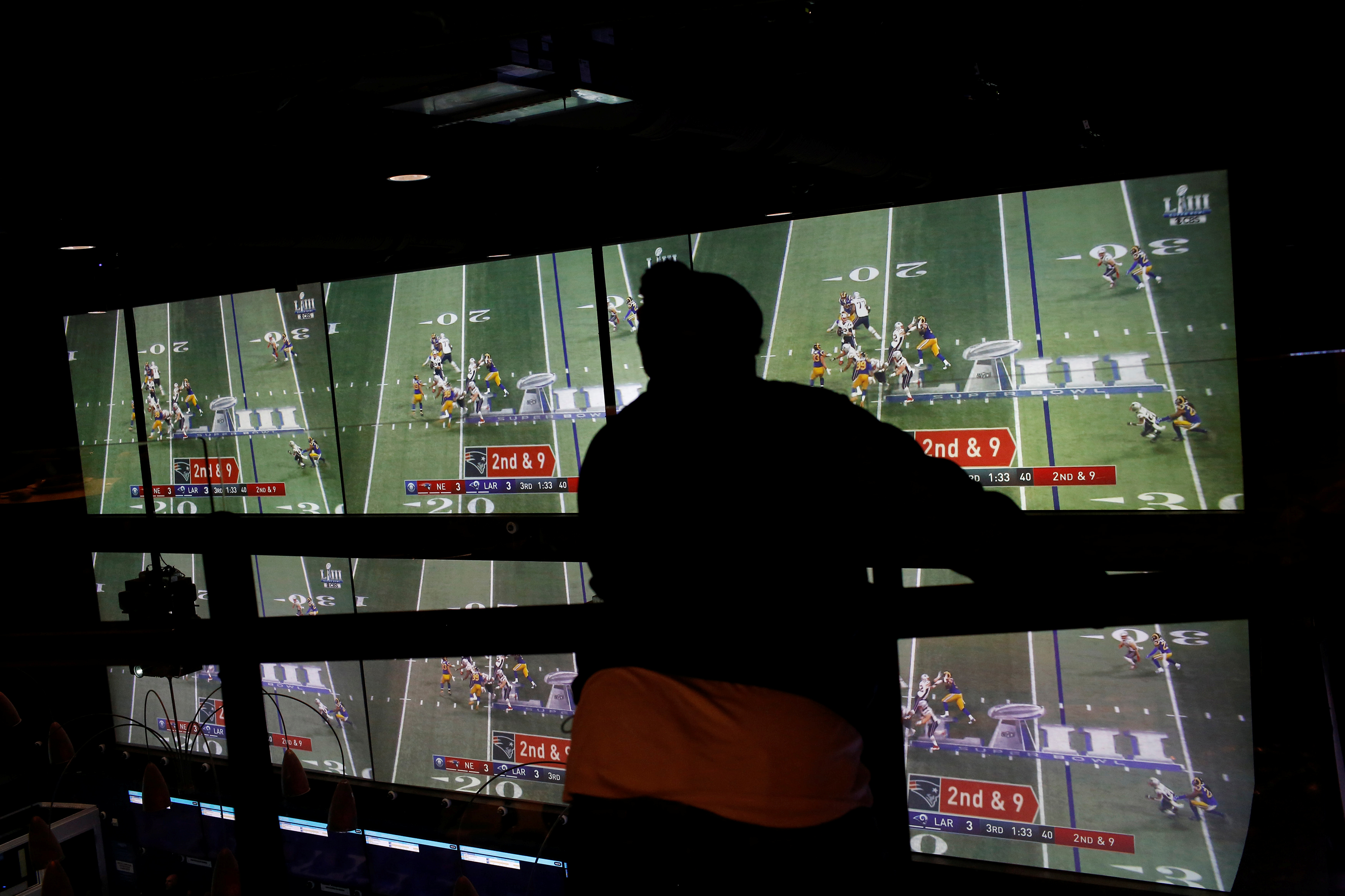 A man watches the game after betting at the FANDUEL sportsbook during the Super Bowl LIII in East Rutherford, New Jersey