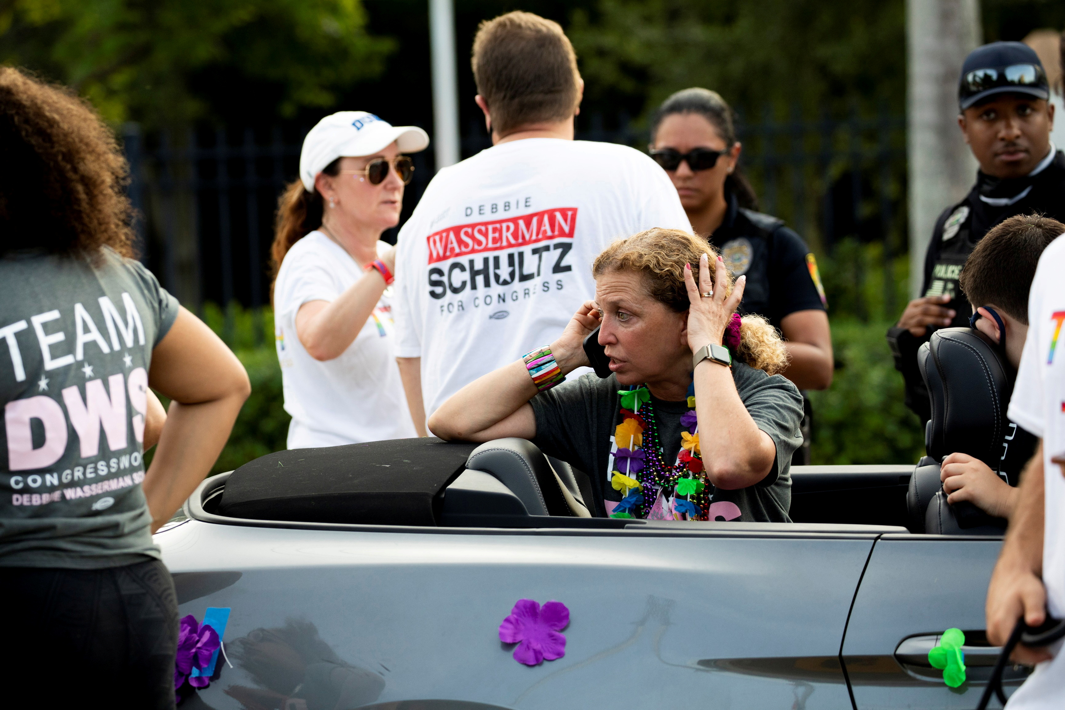Rep. Debbie Wasserman Schultz makes a call after a truck drove into a crowd of people during The Stonewall Pride Parade and Street Festival