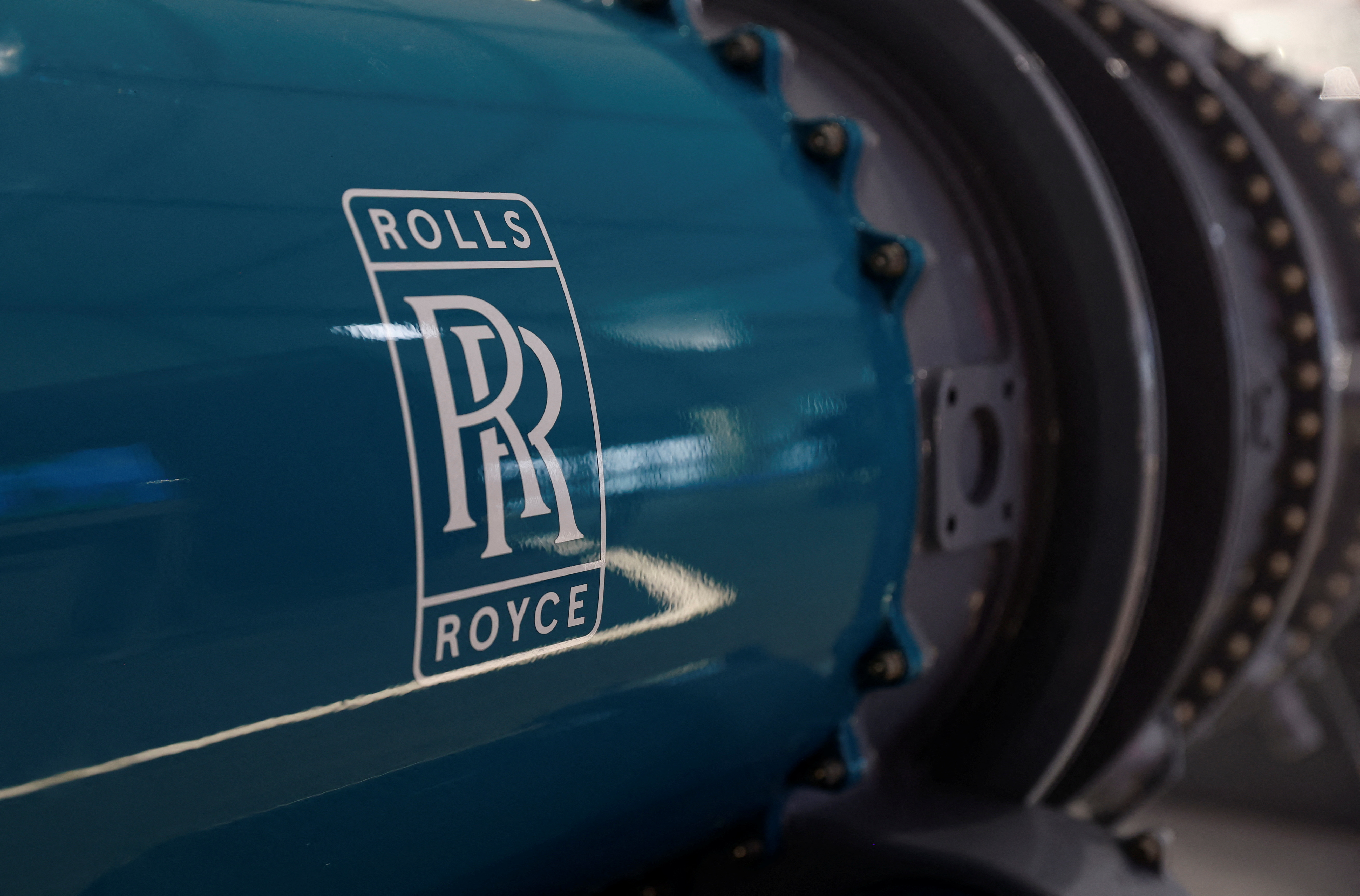 Signage for Rolls Royce is seen on model of an engine at the Farnborough International Airshow, in Farnborough