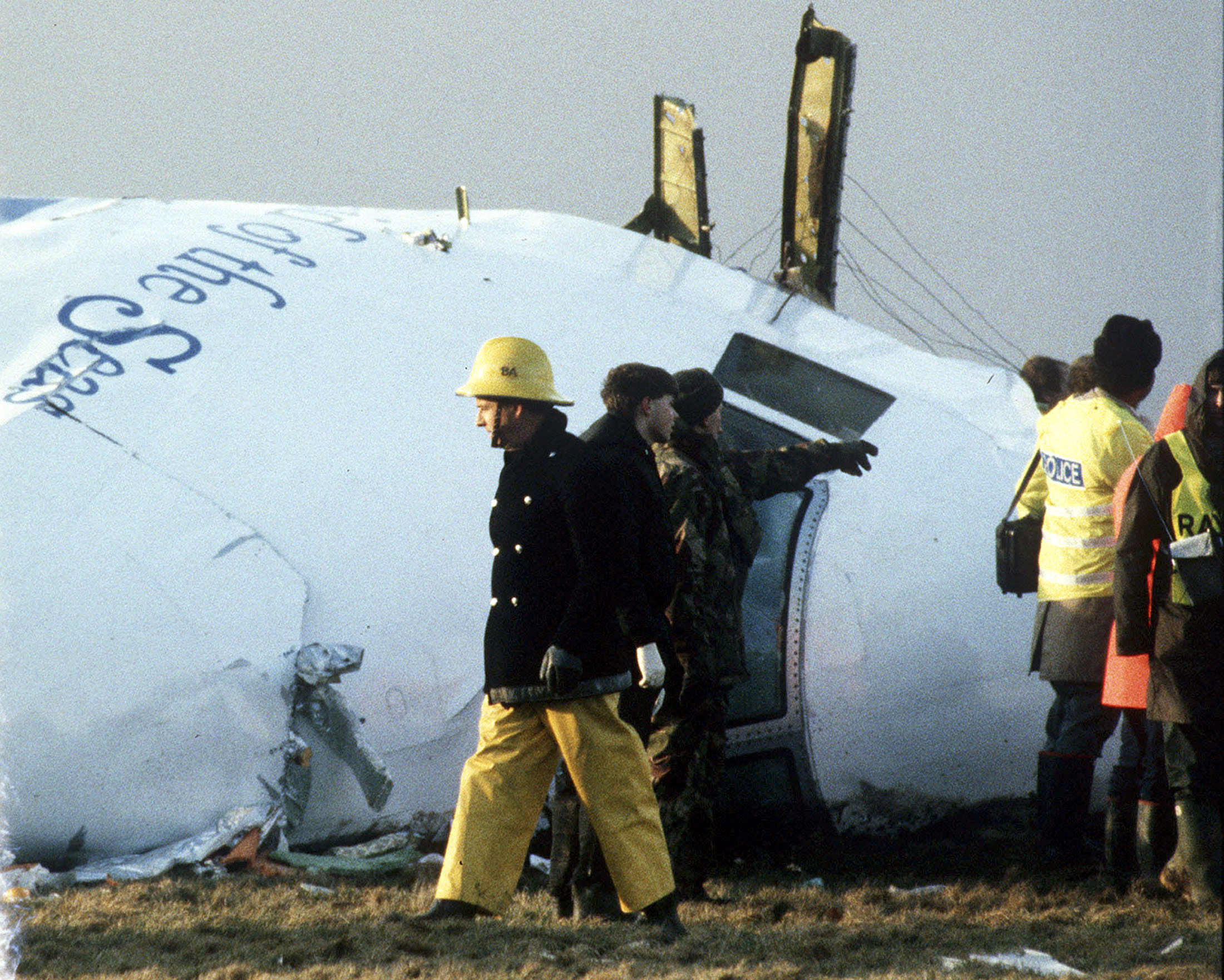 A December 23, 1988 file photo shows Scottish rescue workers and crash investigators search area in Lockerbie.