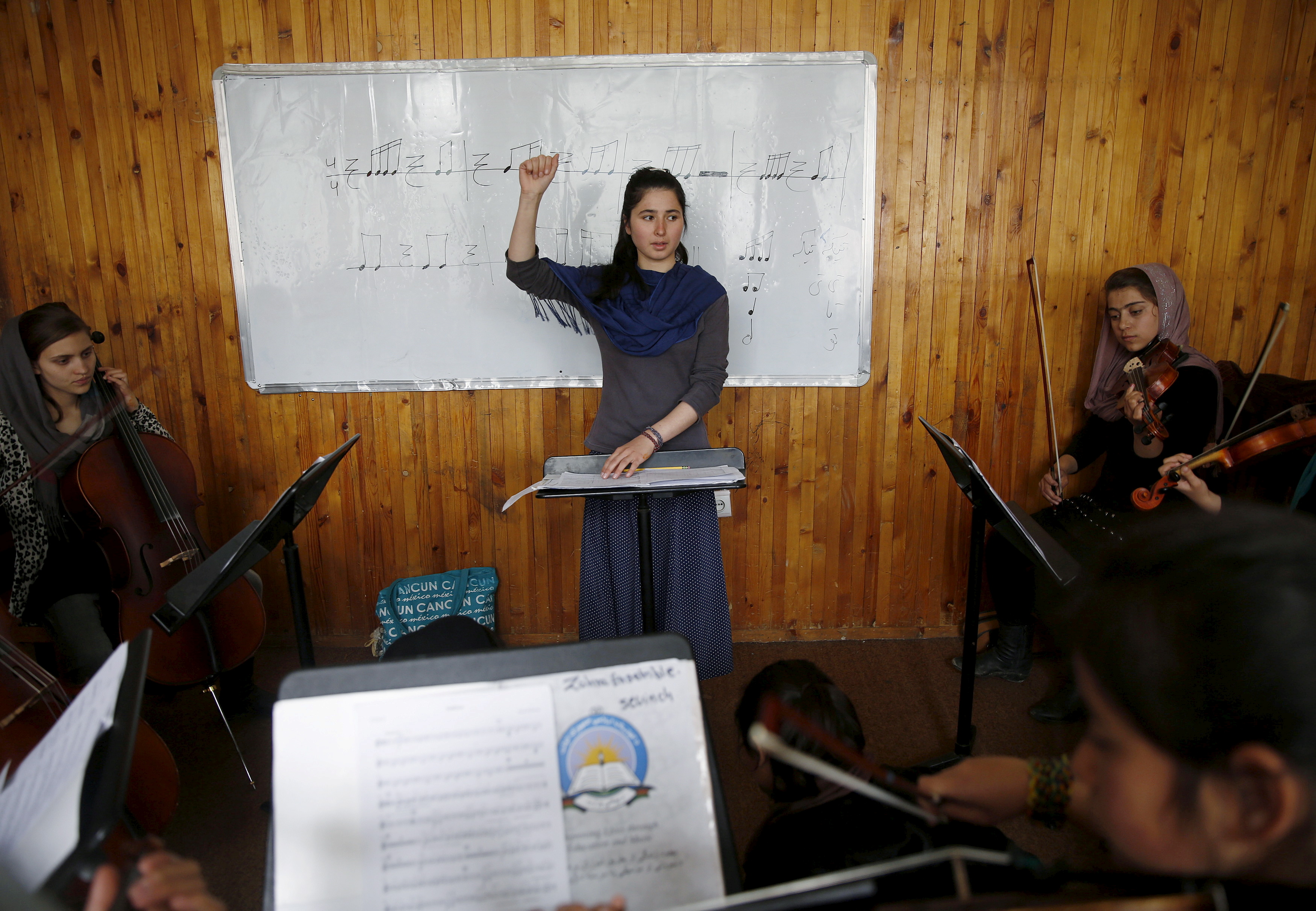 Members of the Zohra orchestra, an ensemble of 35 women, practises during a session, at Afghanistan's National Institute of Music, in Kabul