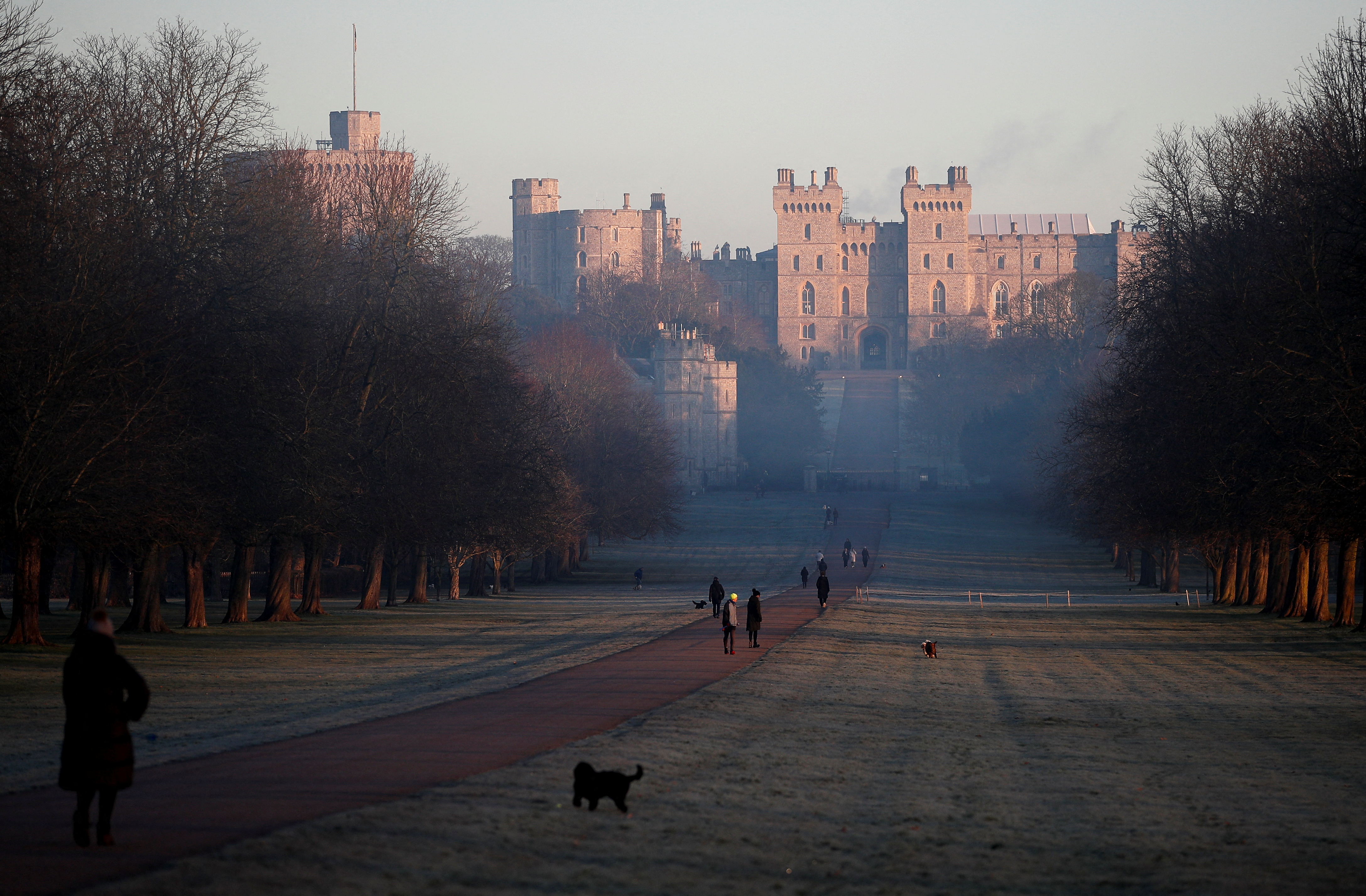 People walk on the Long Walk near Windsor Castle