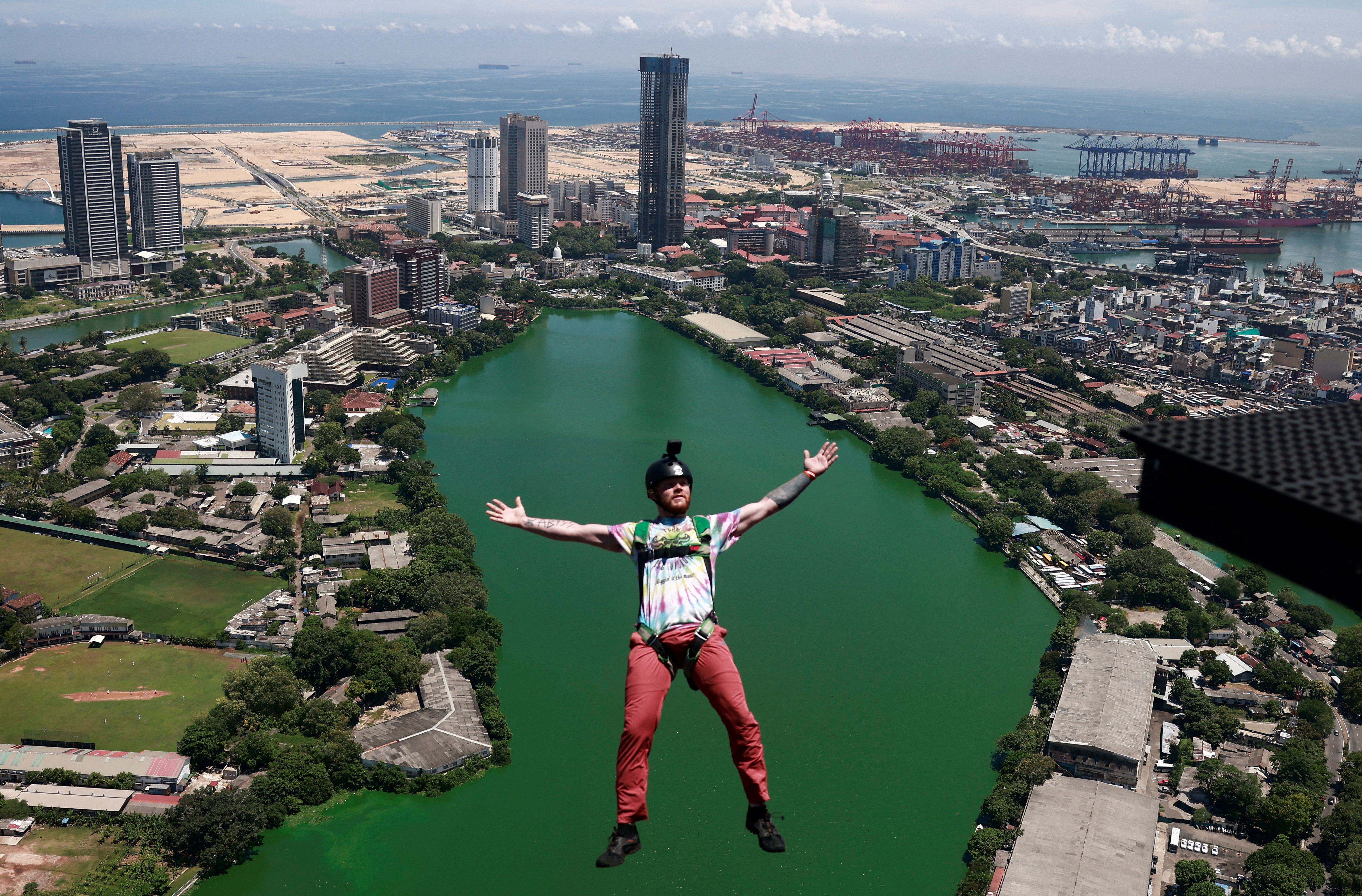 A base jumper leaps off the Lotus Tower, a 351.5 m tall tower in Colombo