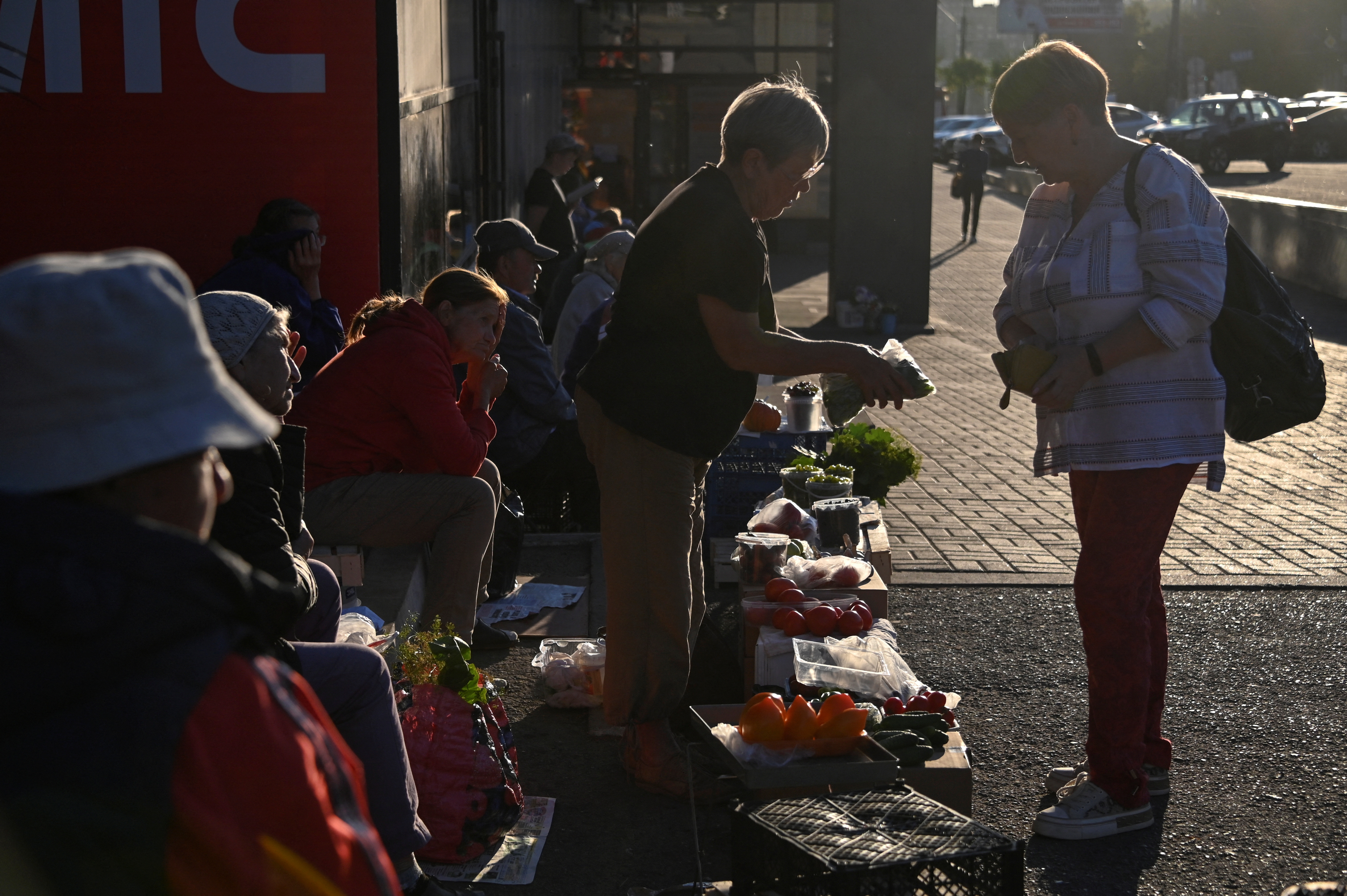 Vendors sell vegetables and other foodstuffs in a street in Izhevsk