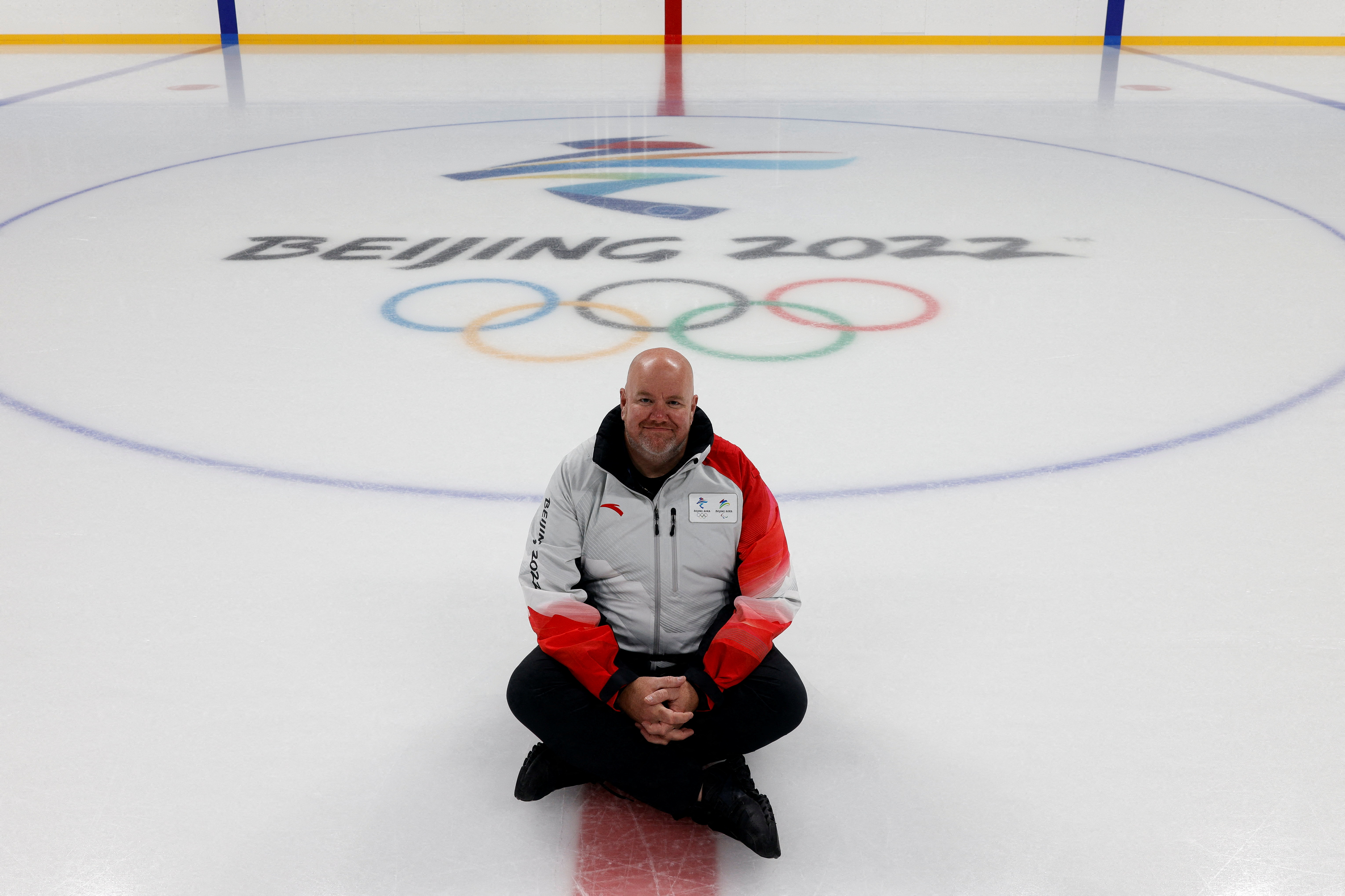 Rick Ragan, chief icemaker for the main hockey venue at the 2022 Winter Olympics, the Wukesong Arena, poses for photos, in Beijing