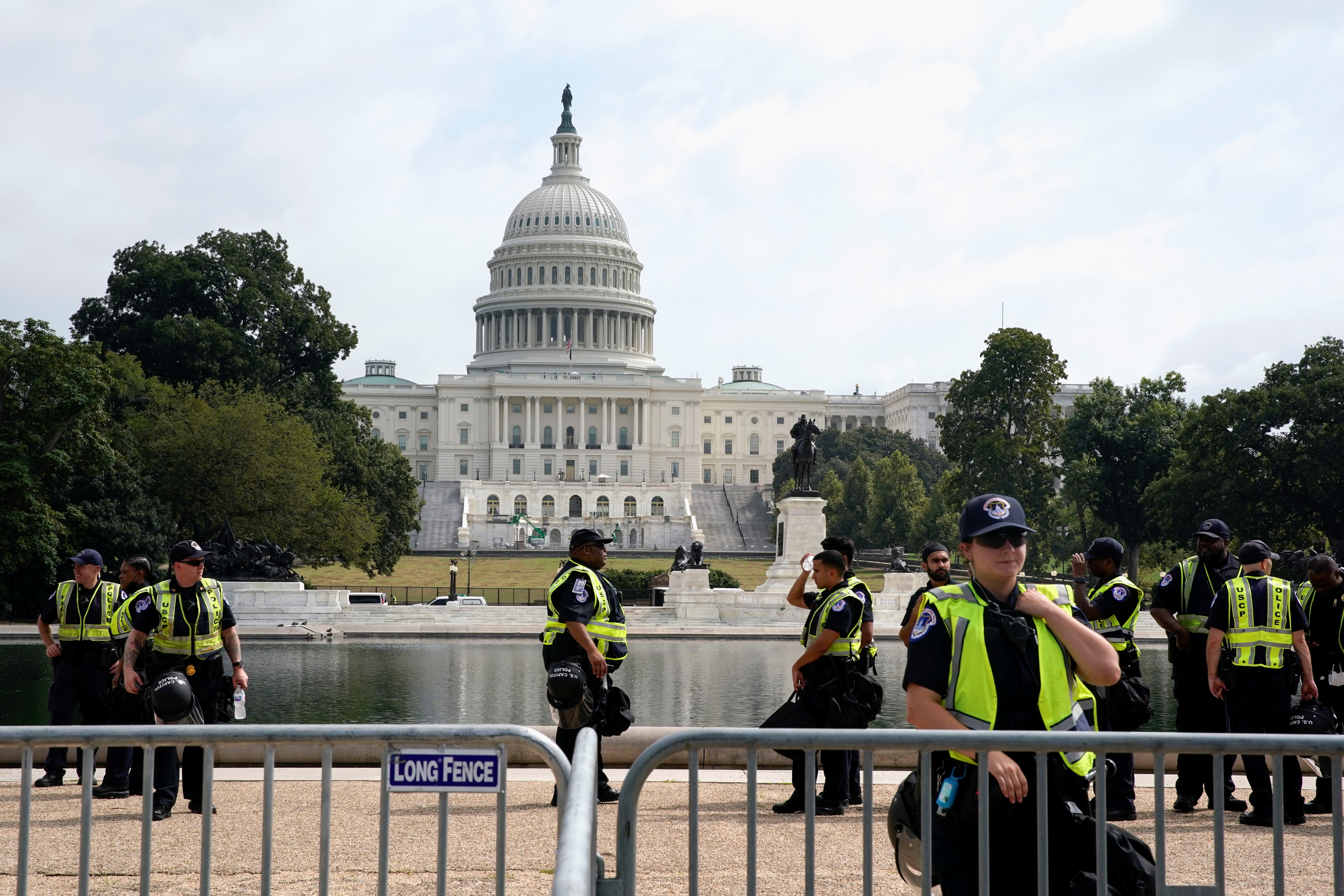 U.S. Capitol police officers stand guard in front of the U.S. Capitol during a protest in support of defendants being prosecuted in the January 6 attack on the Capitol, in Washington