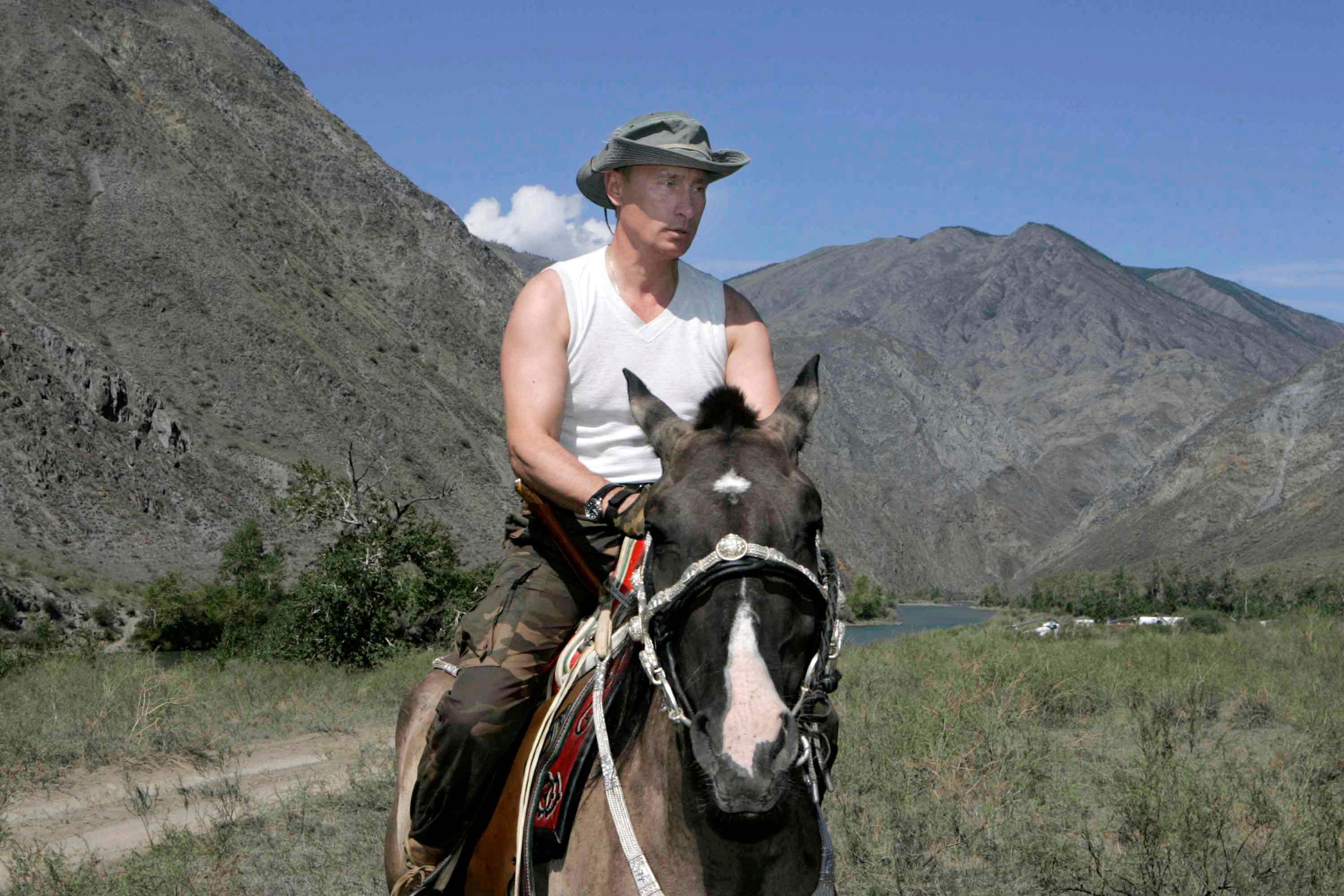 Russian President Vladimir Putin rides a horse near the Western Sayan Mountains in southern Siberia's Tuva region