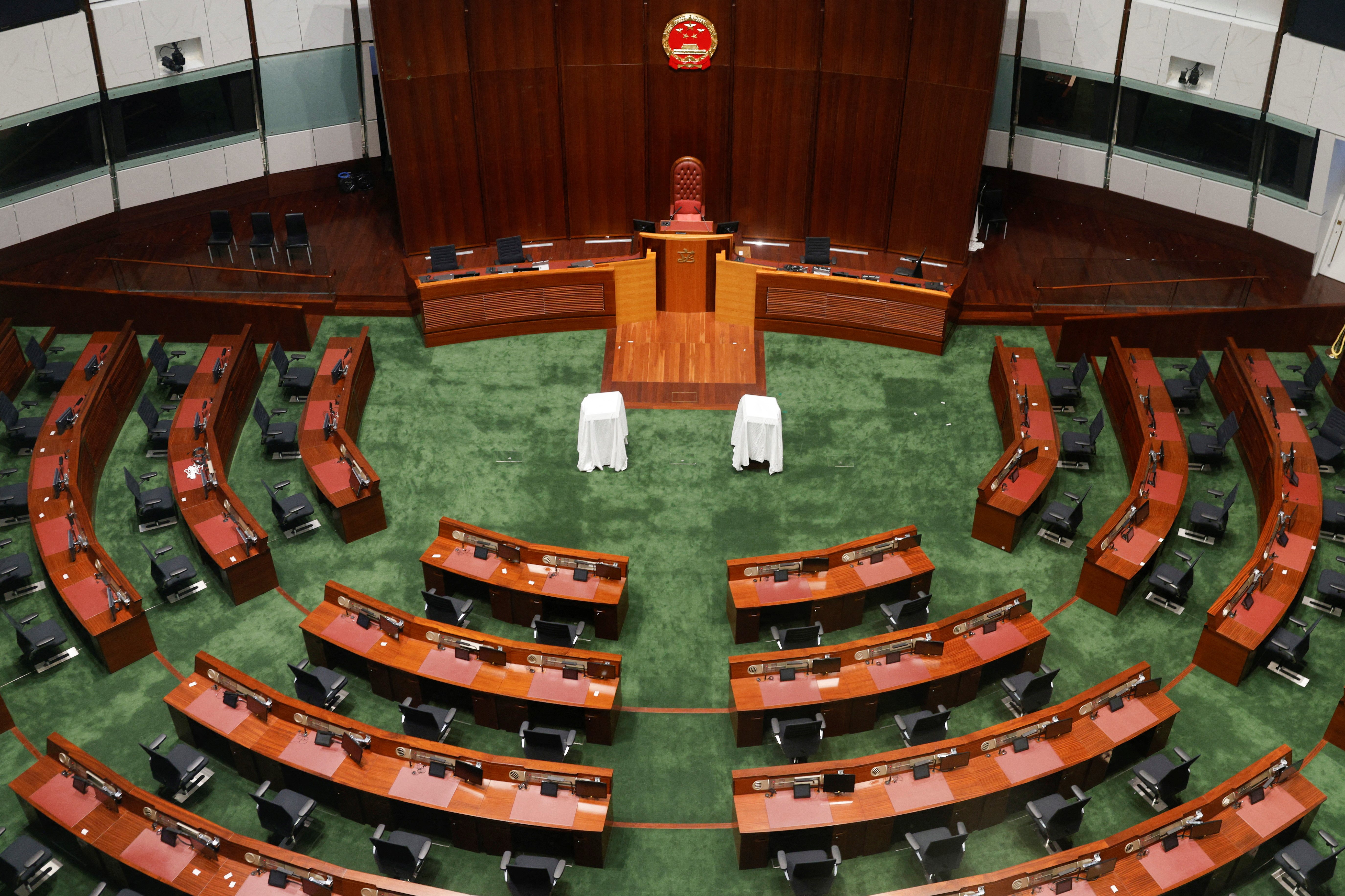 The Chinese national emblem is seen on the wall as it replaces the Hong Kong emblem at the Legislative chamber, before the Legislative Council election in Hong Kong