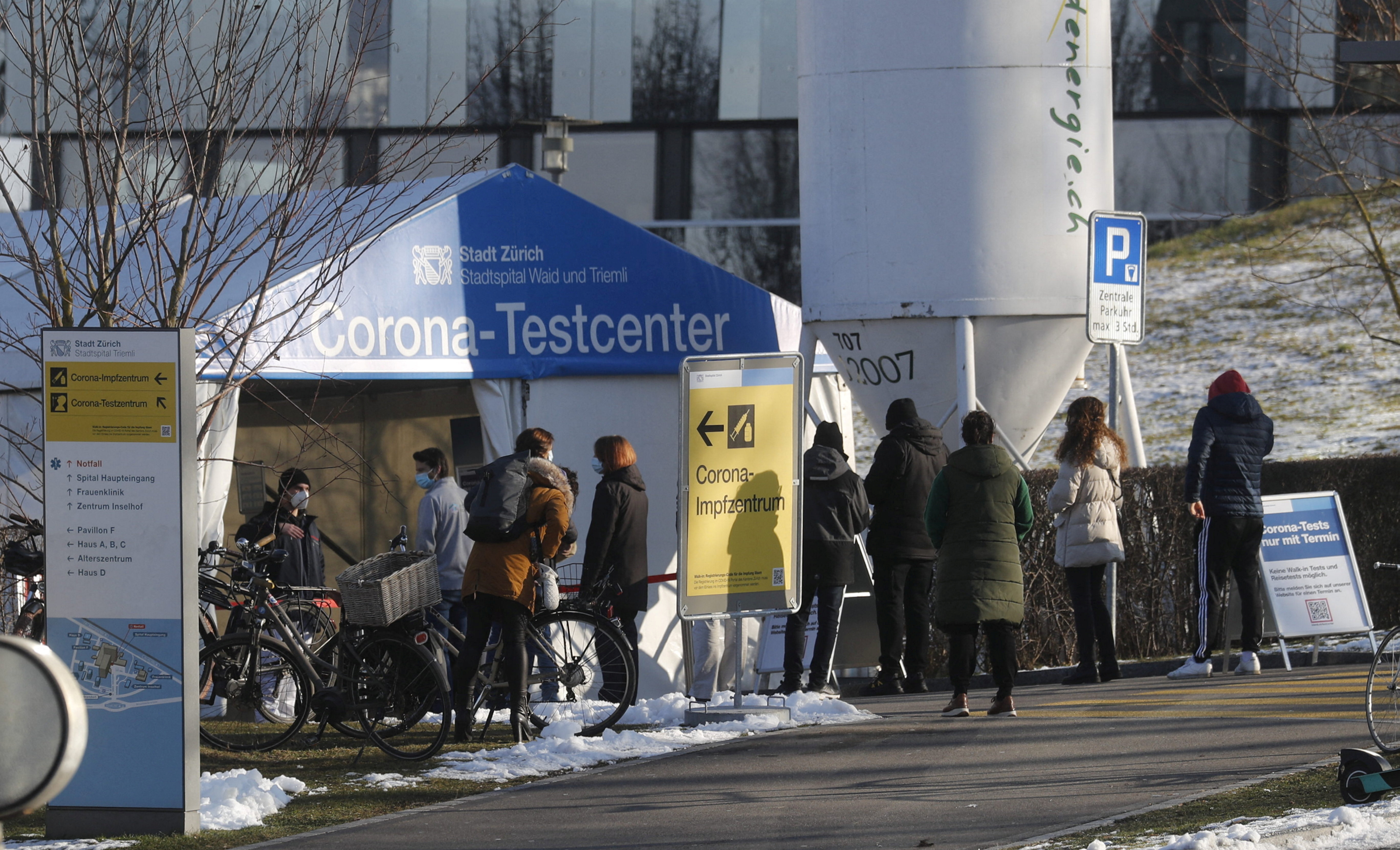 People queue at a coronavirus disease (COVID-19) tests tent at the Stadtspital Triemli hospital in Zurich