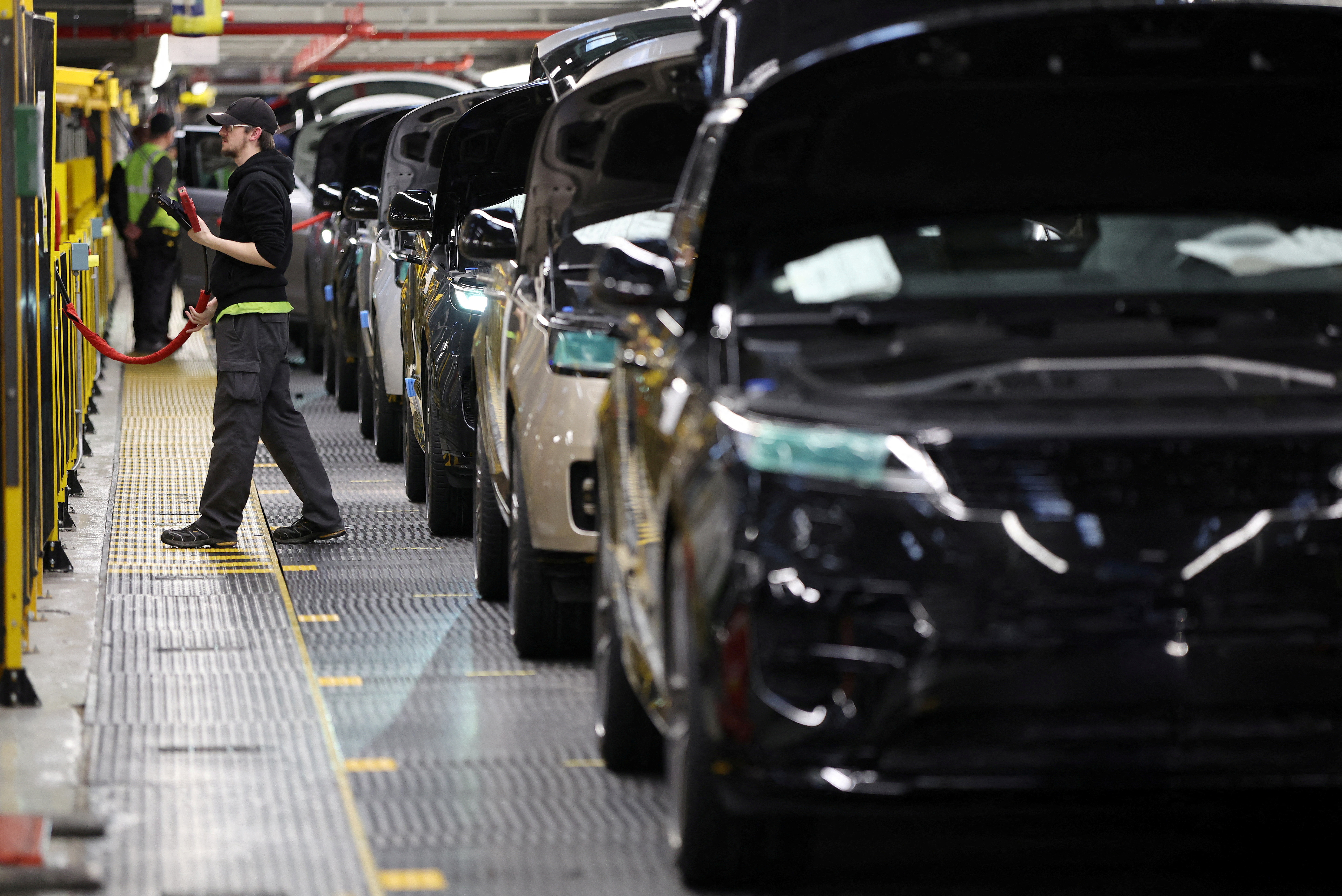 A member of staff works on the production line at Jaguar Land Rover’s factory in Solihull