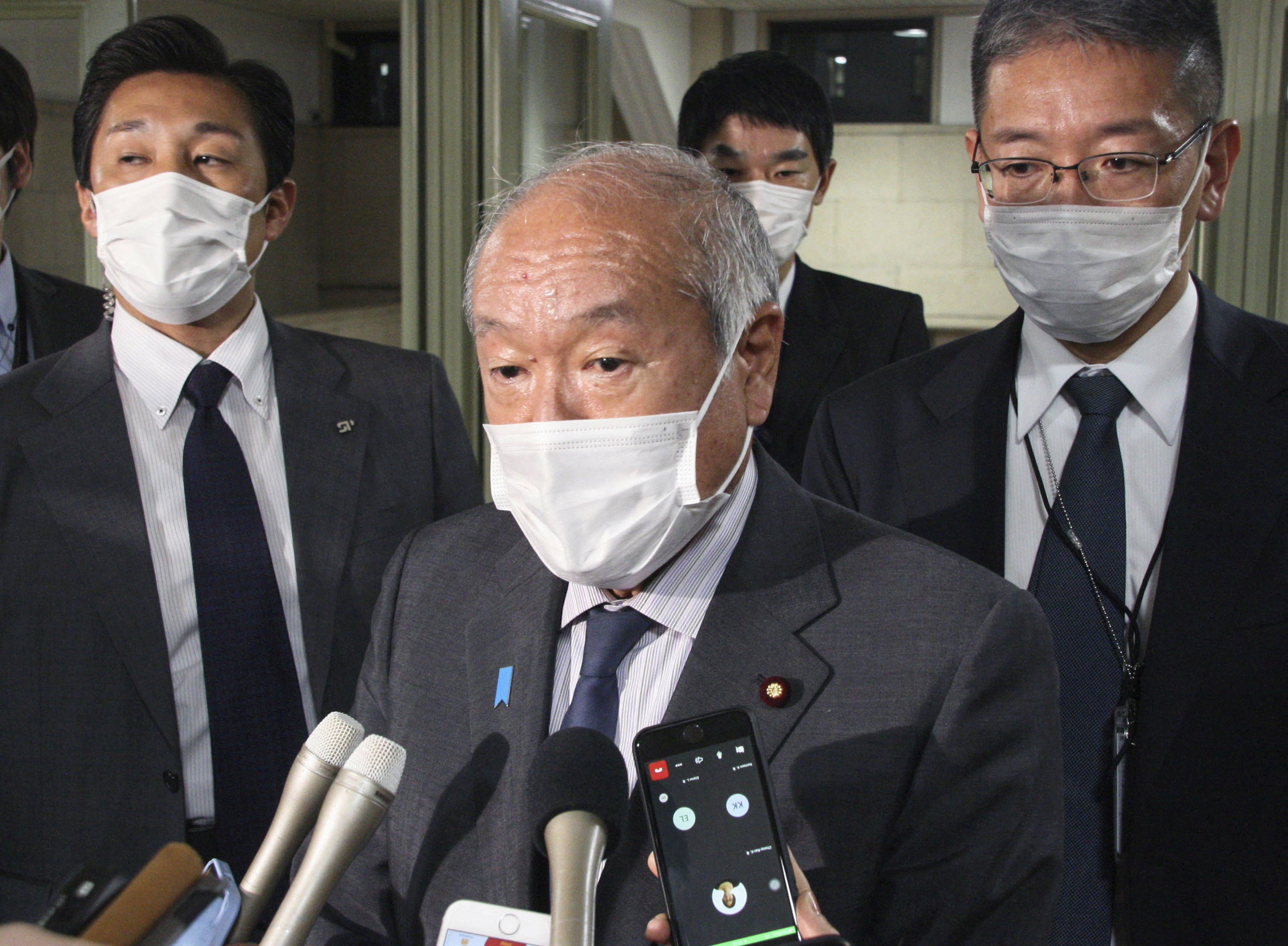 Japan's Finance Minister Shunichi Suzuki speaks to media in Tokyo
