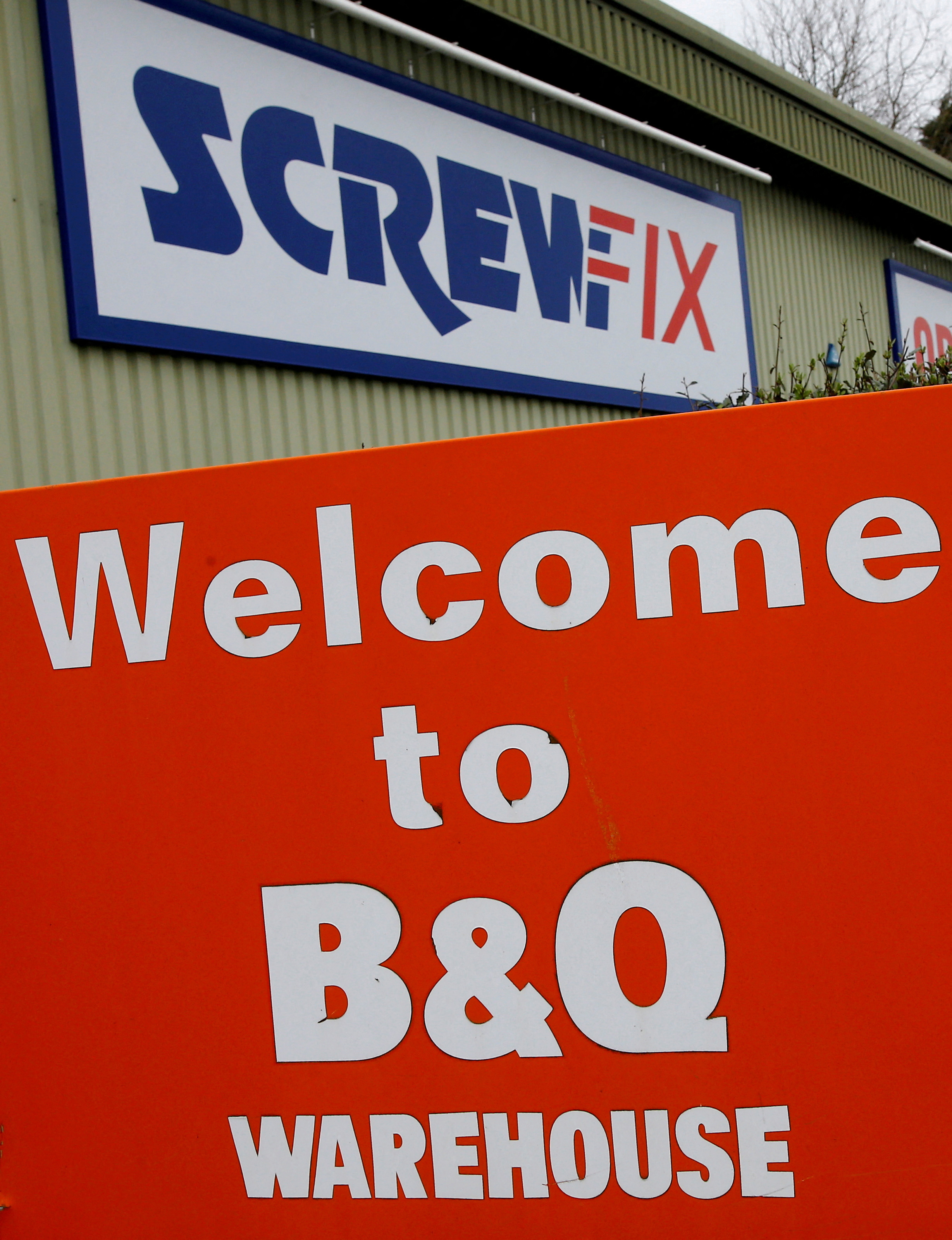 Signs outside the B&Q and Screwfix stores in Loughborough, Britain