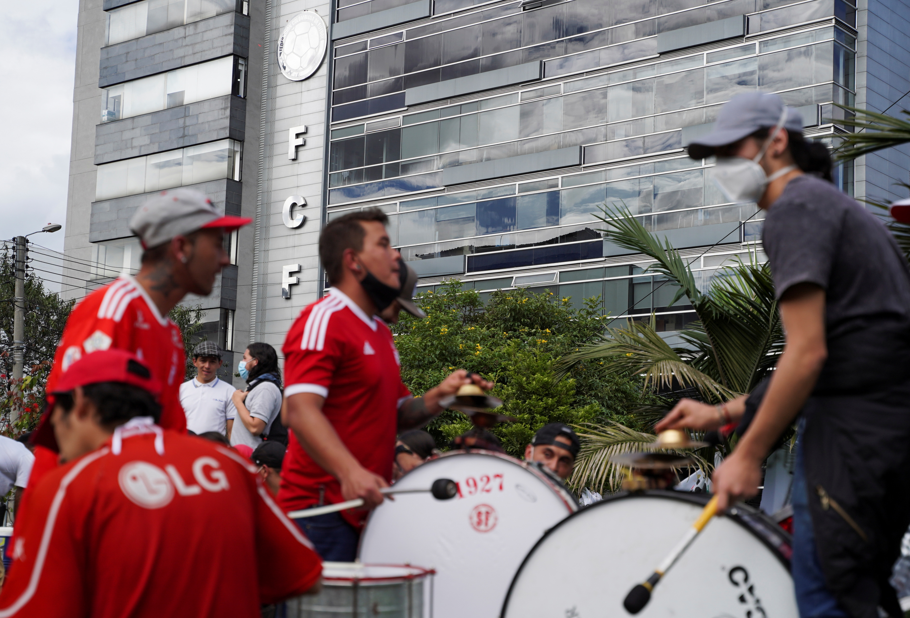 Soccer fans play the drums during a sit-in, in front of the Colombian Football Federation (FCF), in Bogota