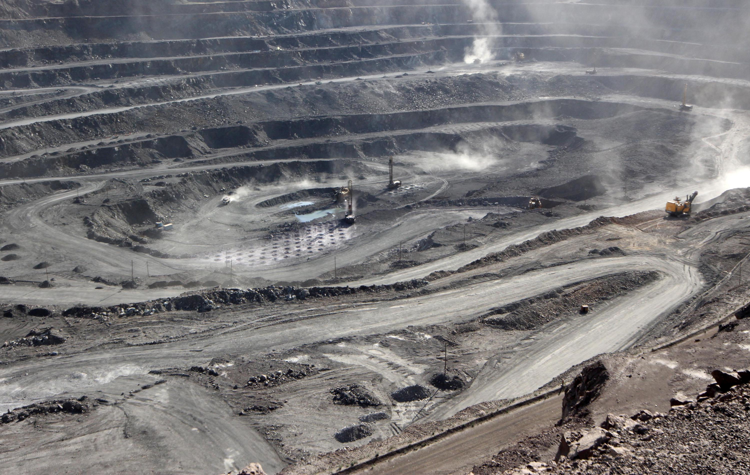 Miners are seen at the Bayan Obo mine containing rare earth minerals, in Inner Mongolia