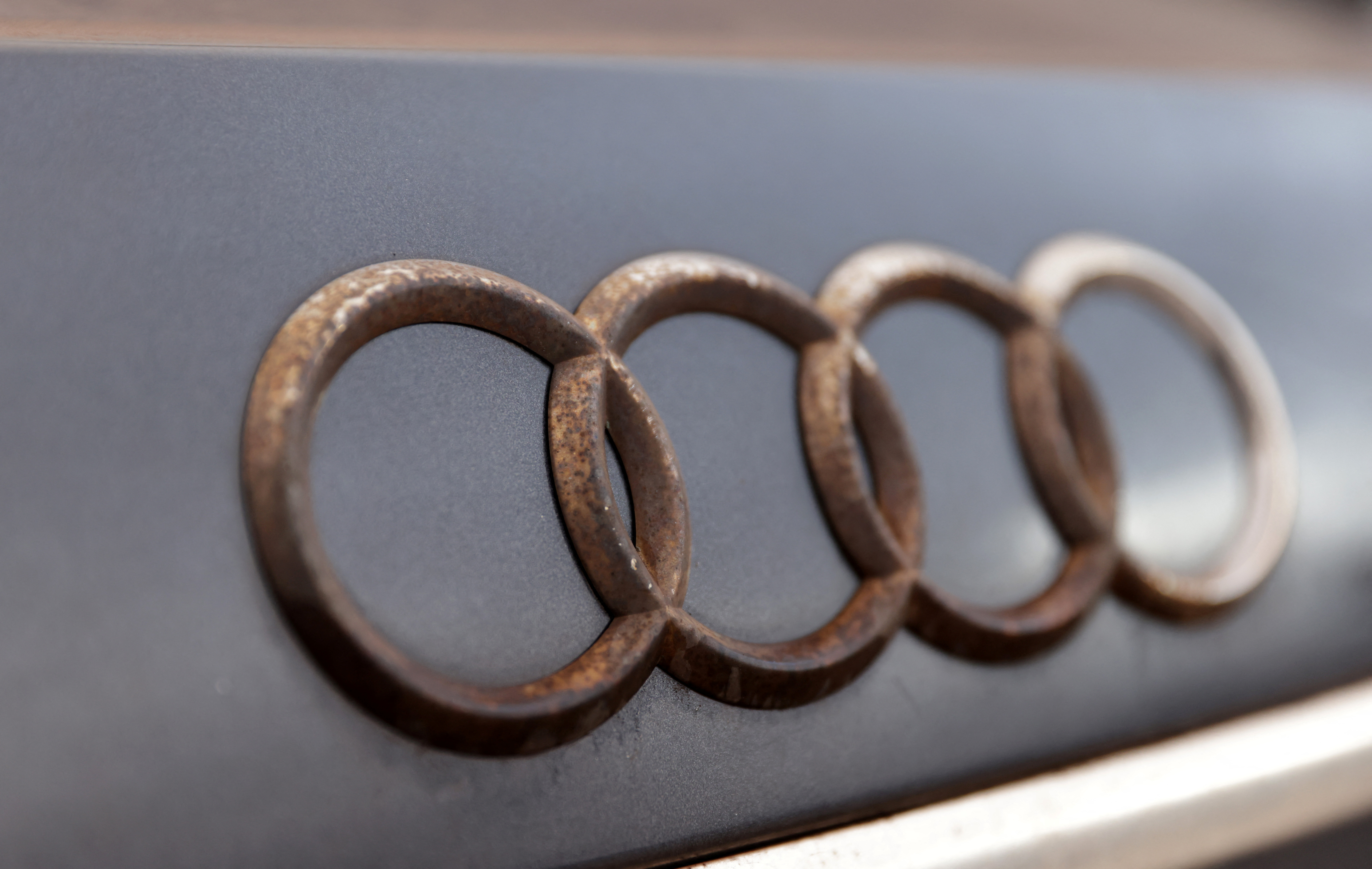 Rusty Audi logo is seen on car waste in Zenica