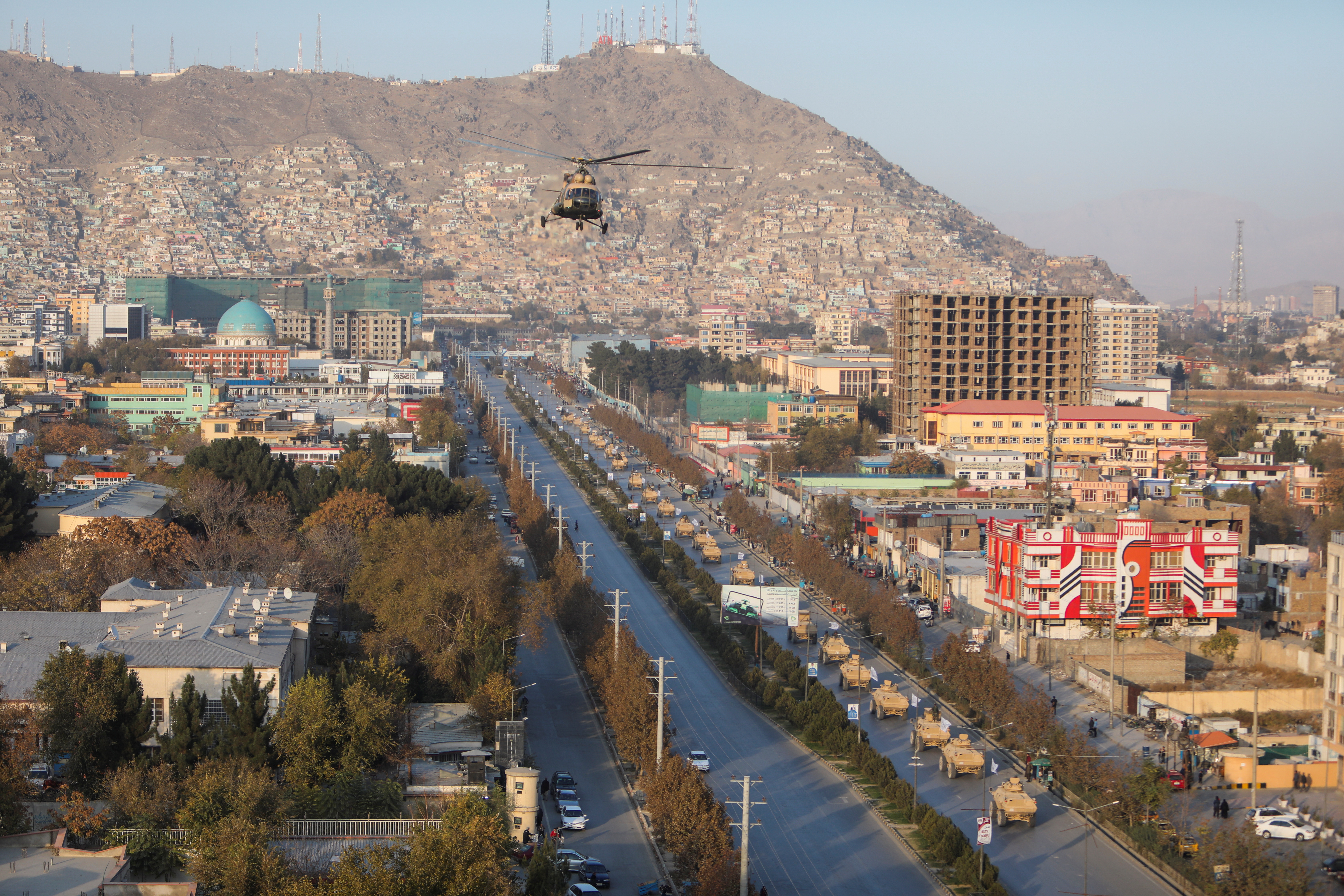 A military helicopter is pictured during the Taliban military parade in Kabul, Afghanistan November 14, 2021. REUTERS/Ali Khara 