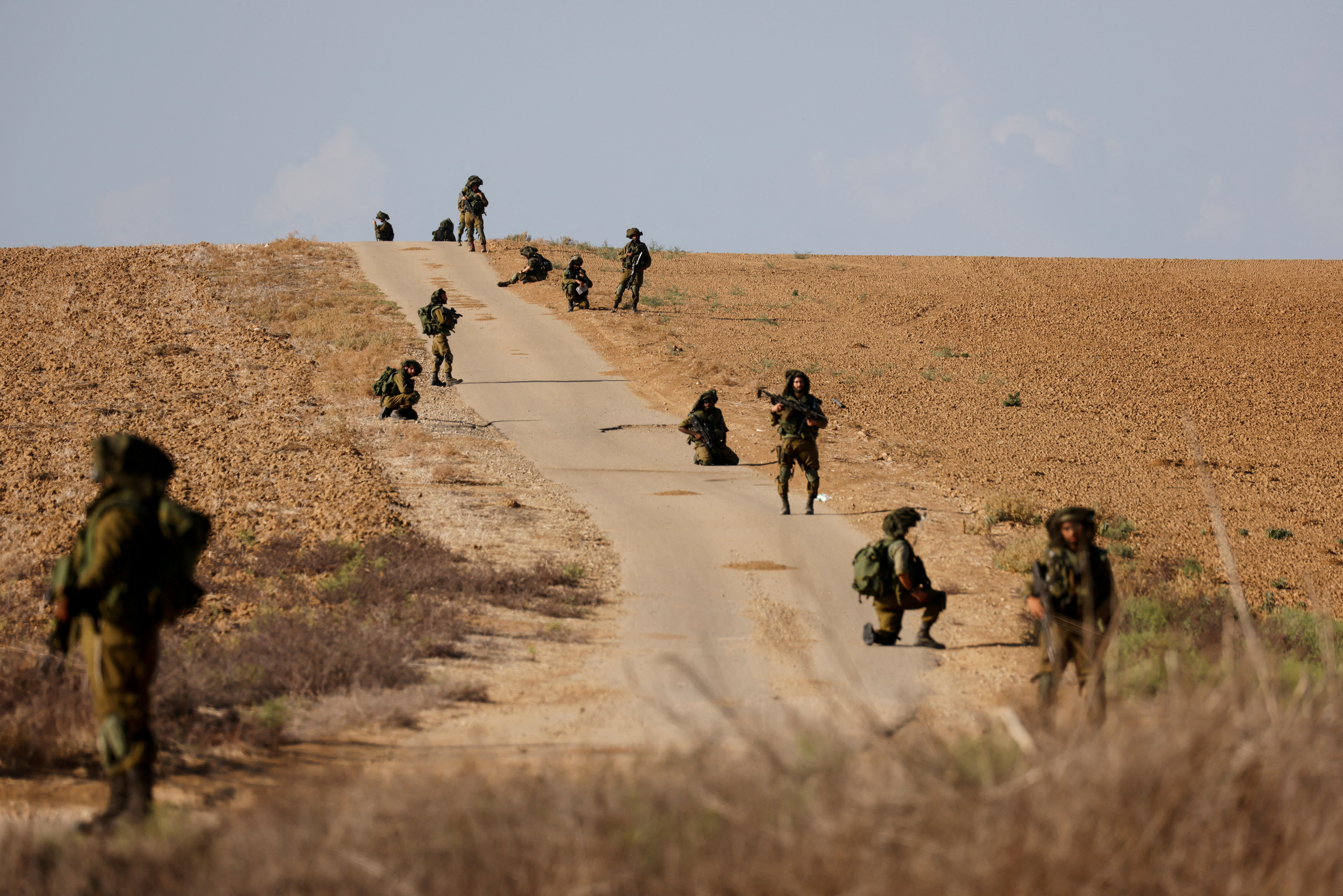 Israeli soldiers patrol an area near Israel's border with the Gaza Strip, in southern Israel