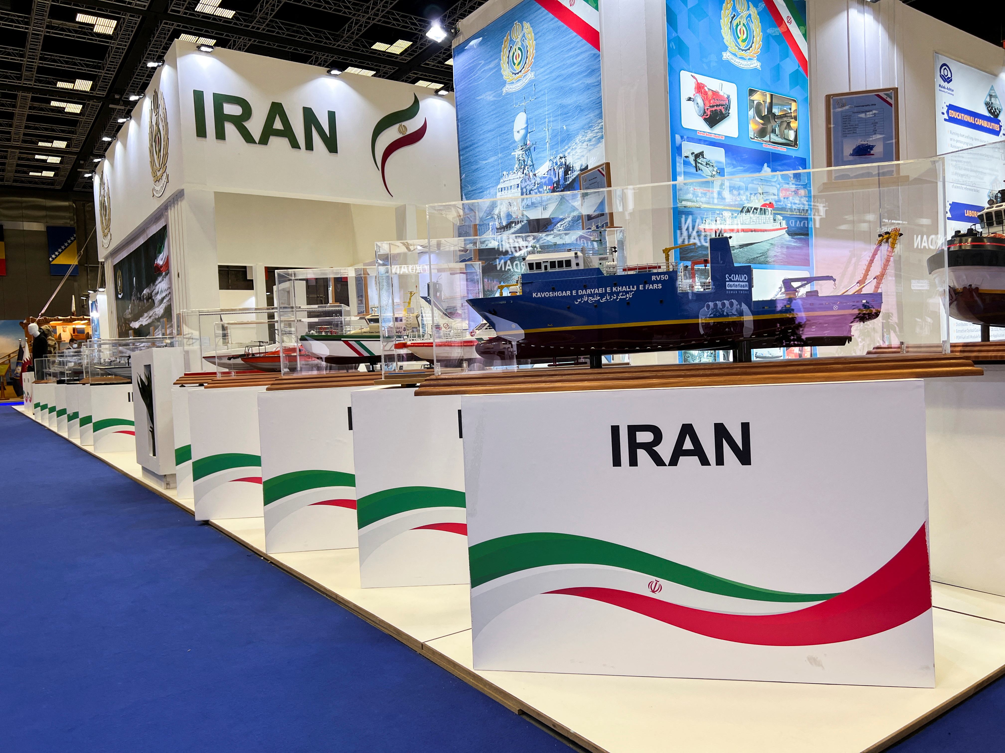 Military boat models are displayed at the IRGC booth at the Doha International Maritime Defense Exhibition and Conference (DIMDEX) in Doha