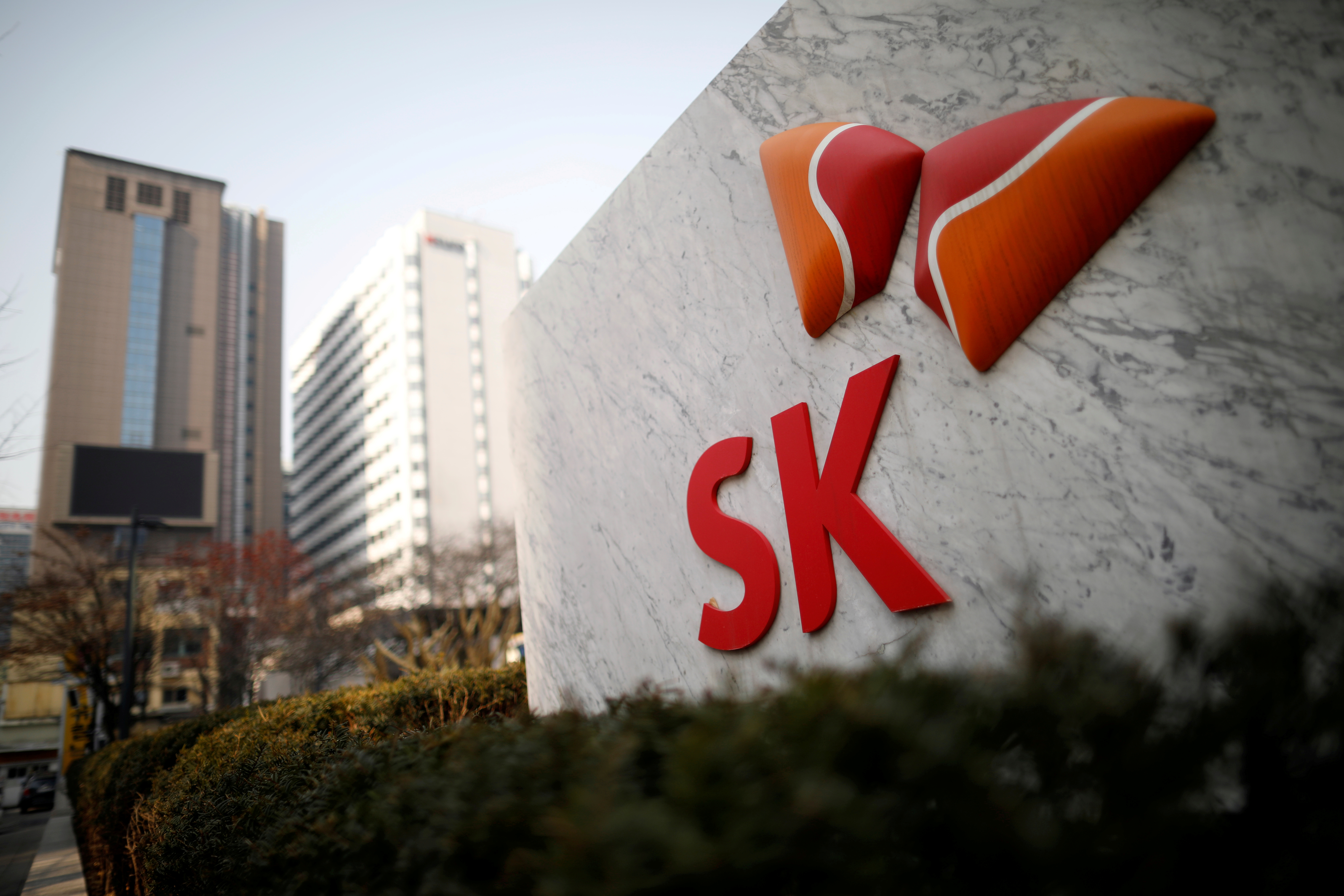 The logo of SK Innovation is seen in front of its headquarters in Seoul