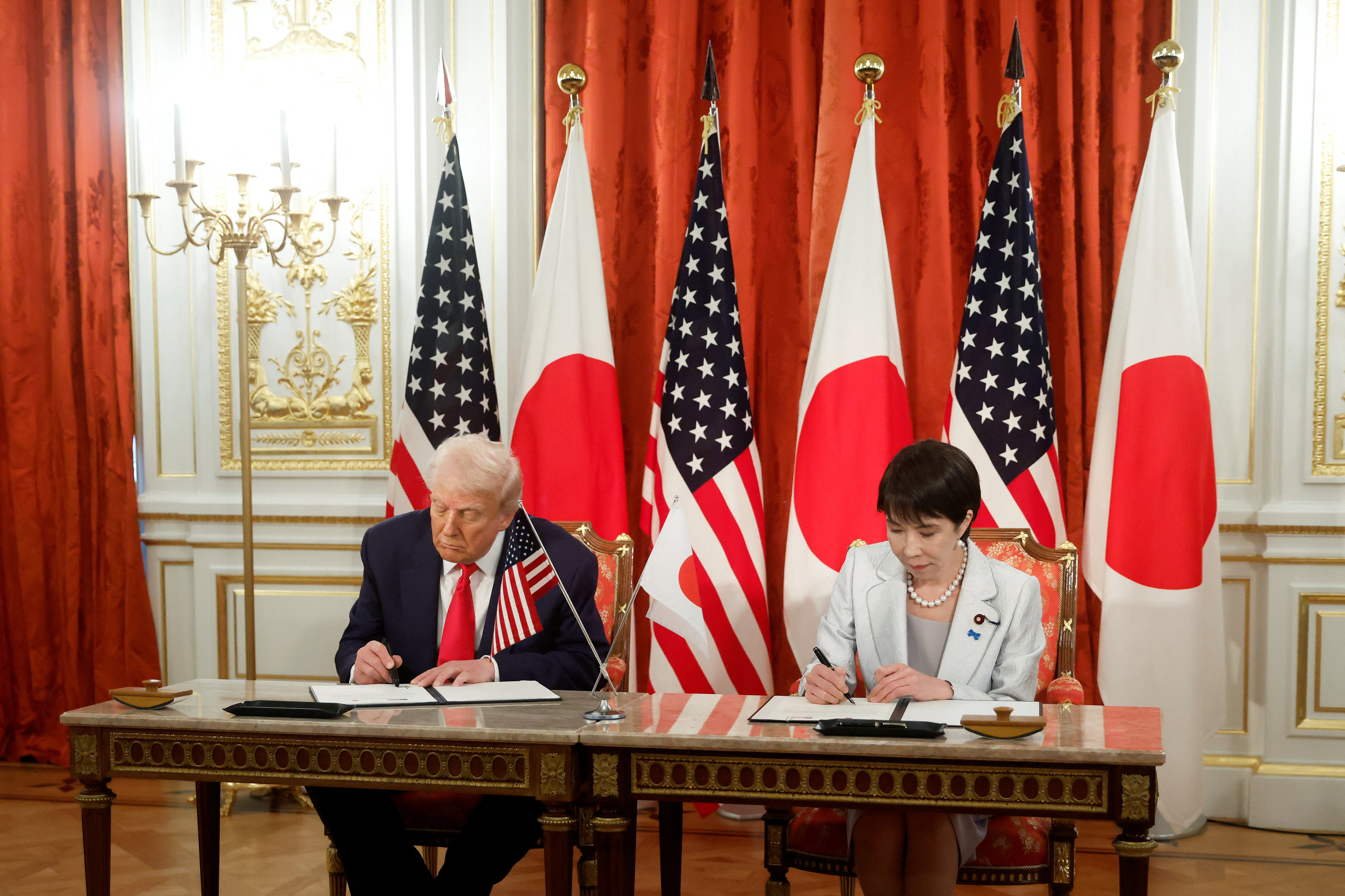 Trump heaps praise on Japan's first female leader, signs rare