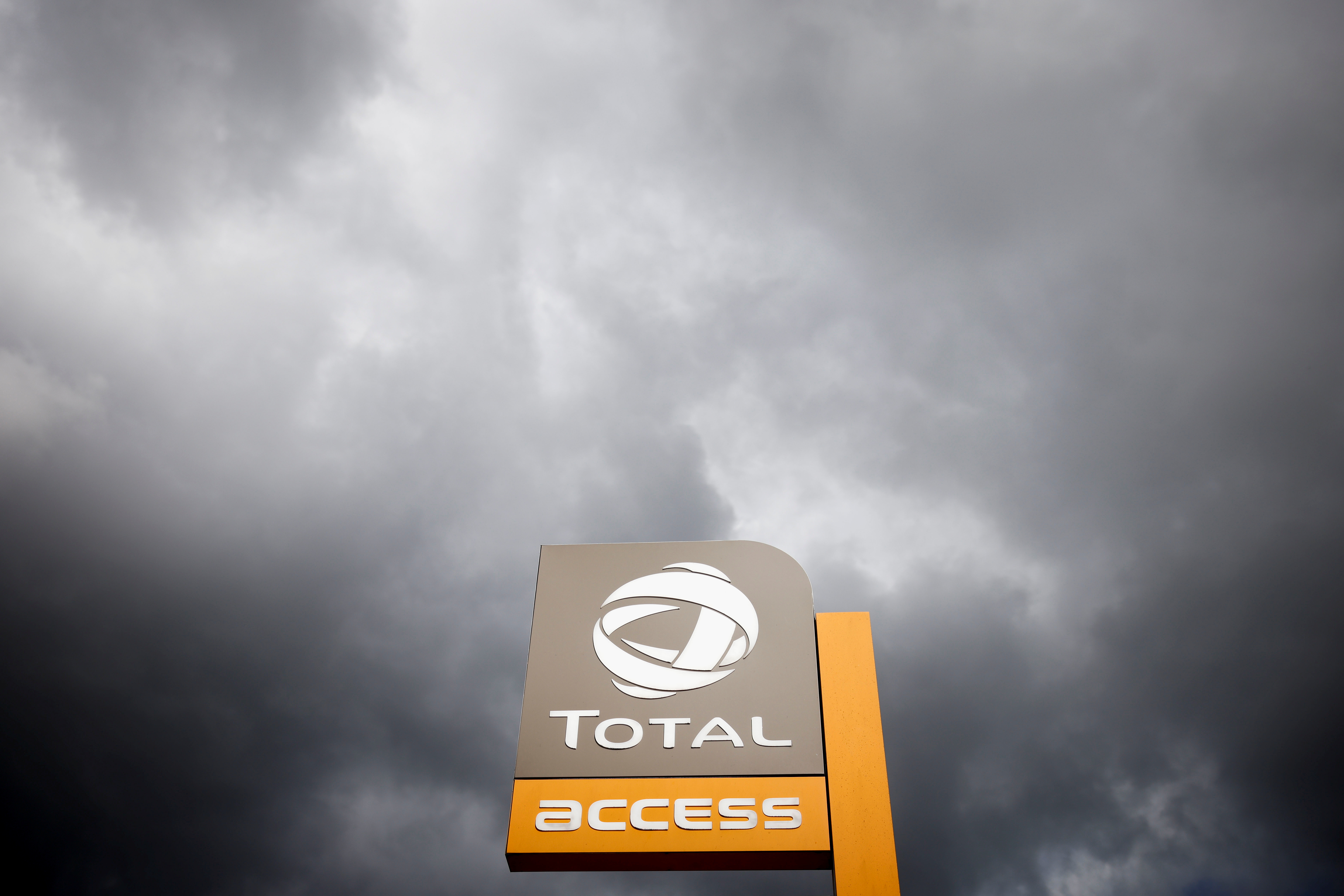 The logo of French oil and gas company Total is pictured at a petrol station in Vertou