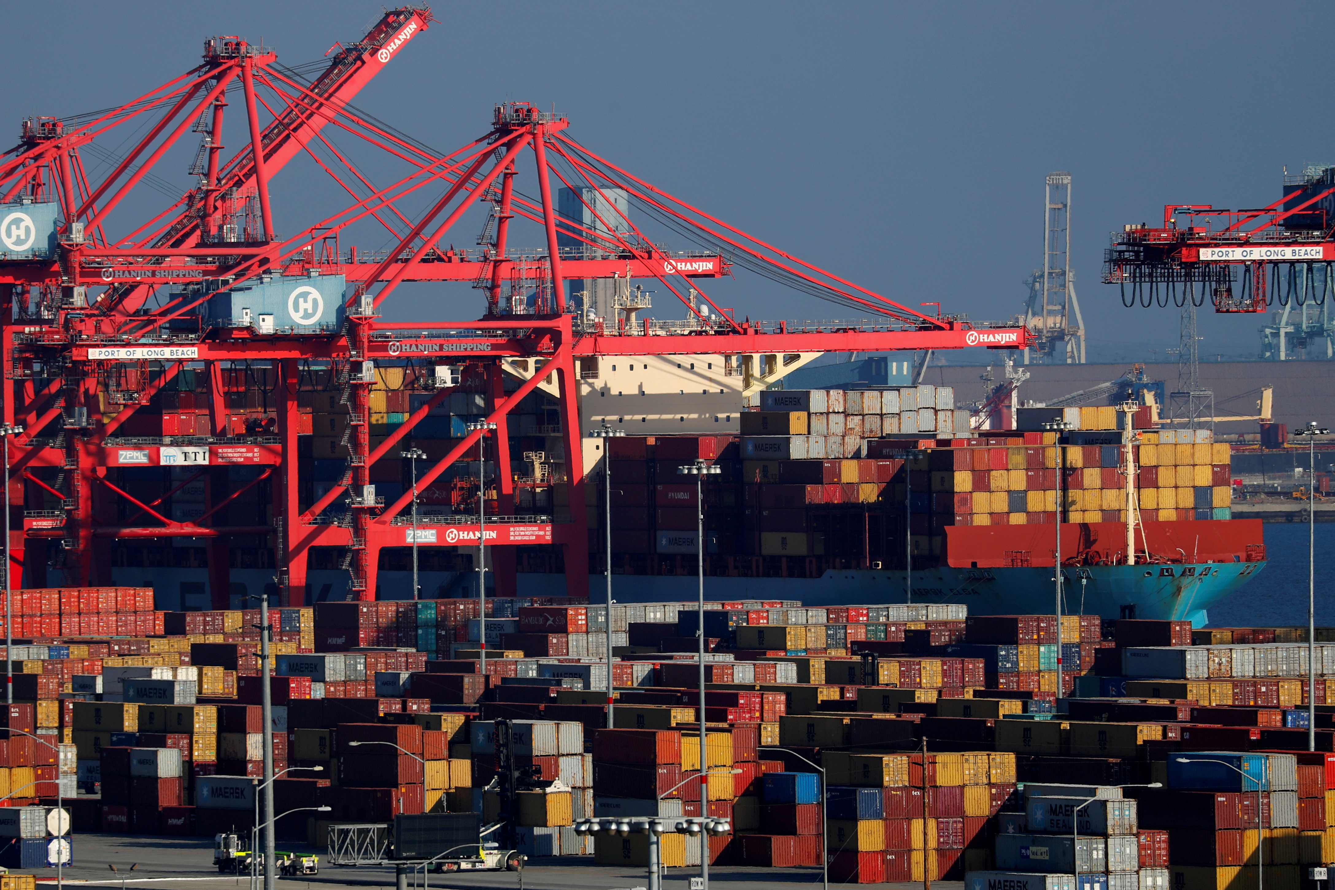 Ships and shipping containers are pictured at the port of Long Beach in Long Beach, California