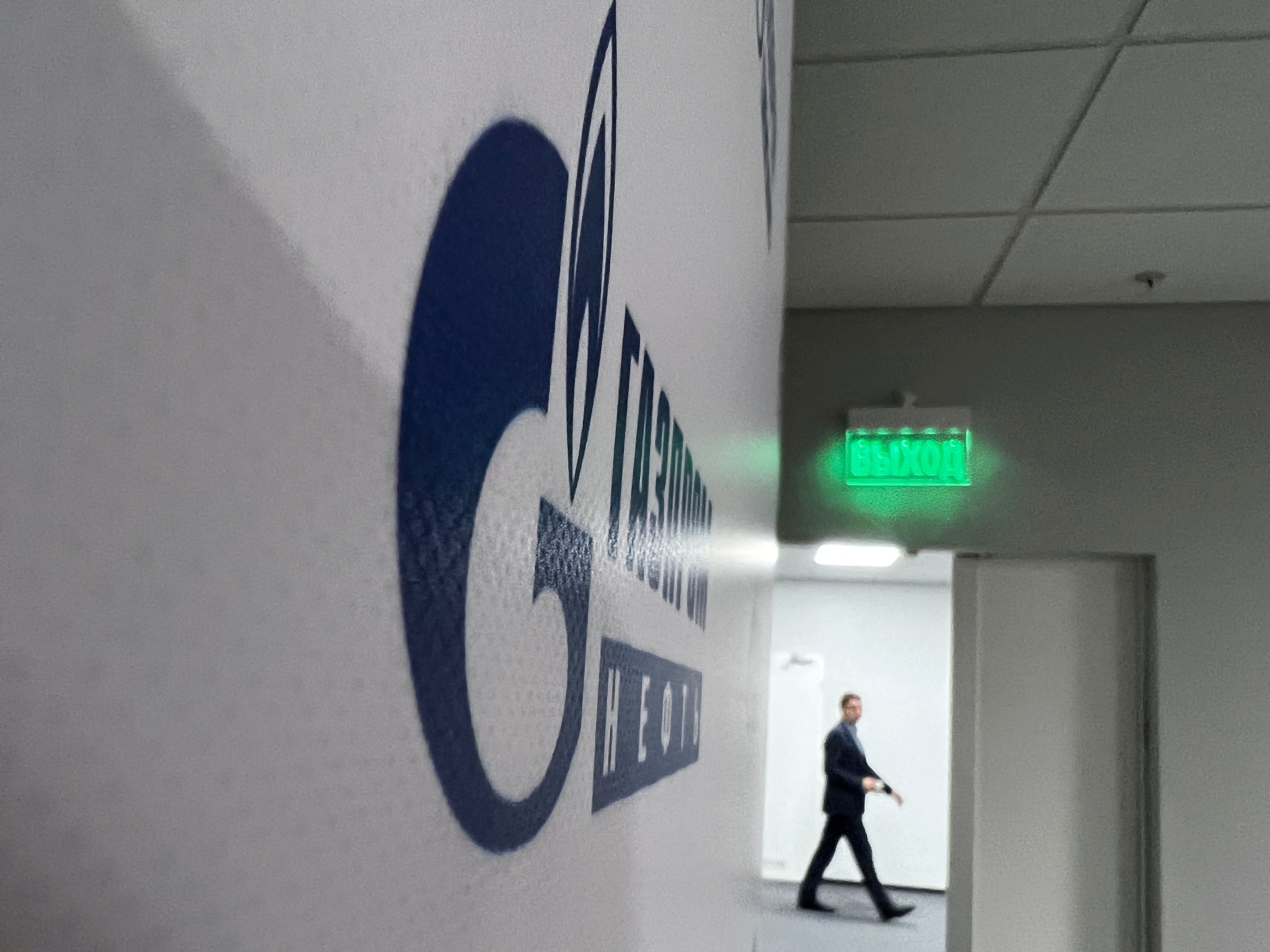 An employee walks at the office of Gazprom Neft company in Khanty-Mansiysk