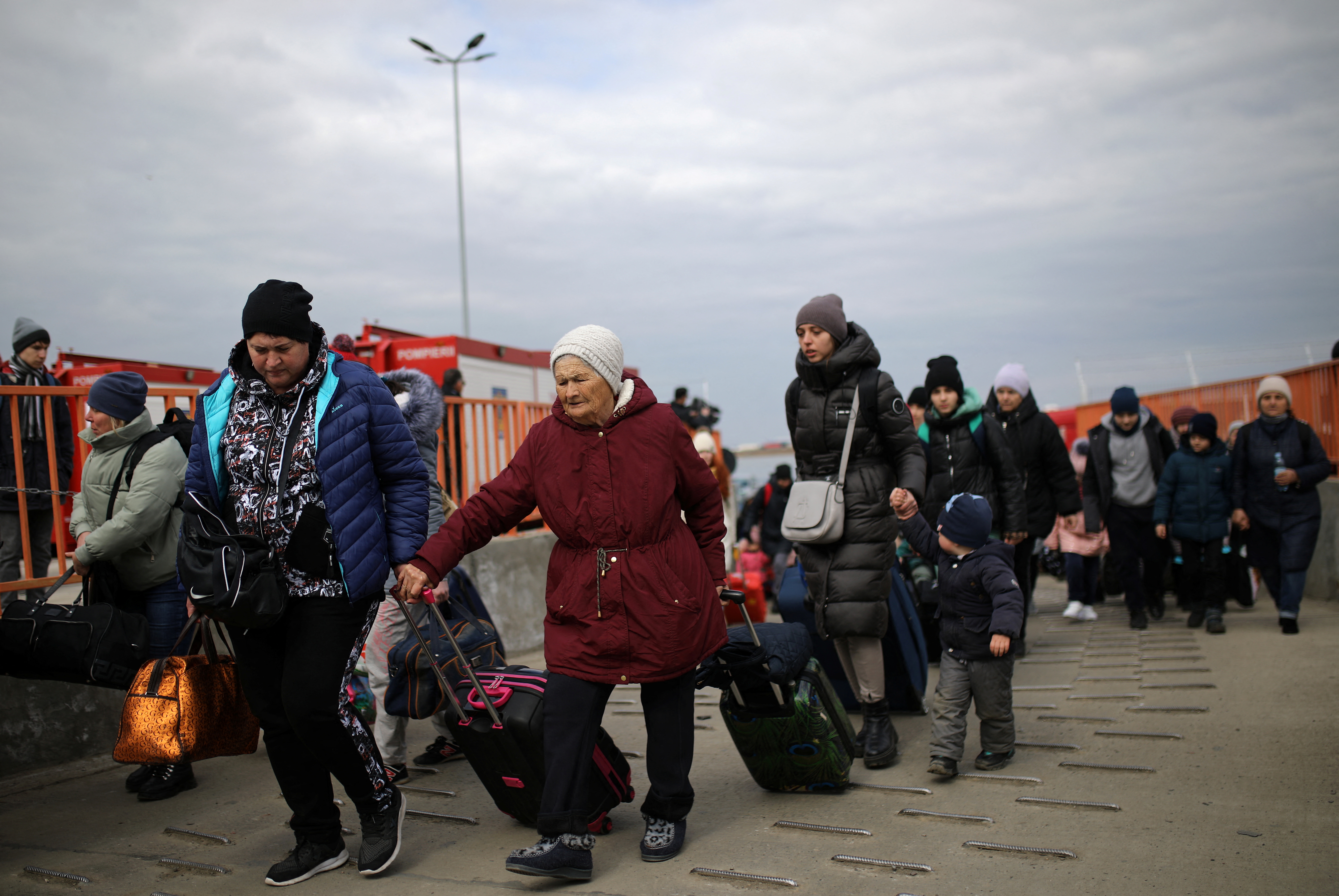 People flee from Ukraine to Romania at the border crossing in Isaccea