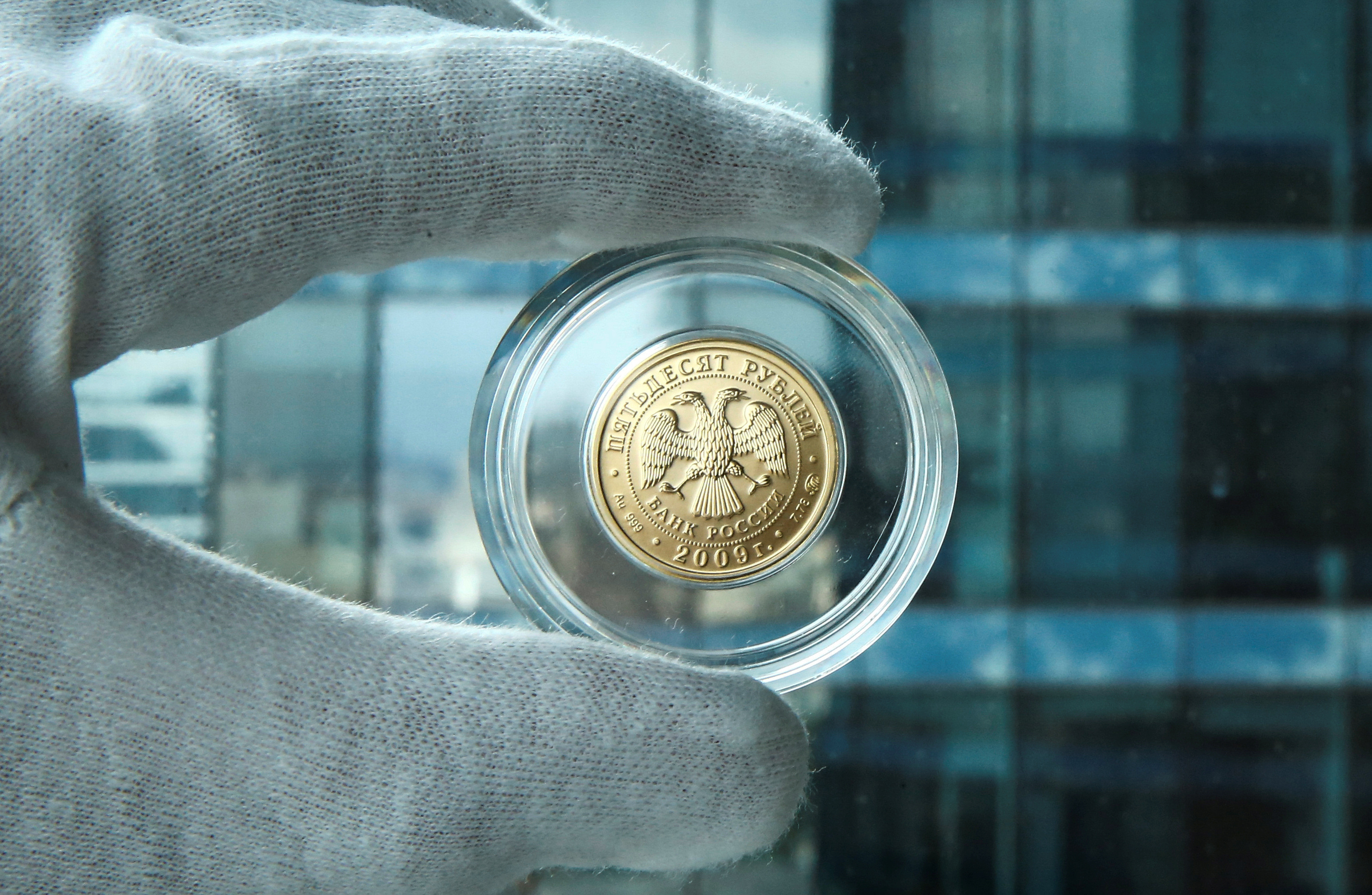 A gold Russian rouble bullion coin is seen in this photo illustration taken in Moscow