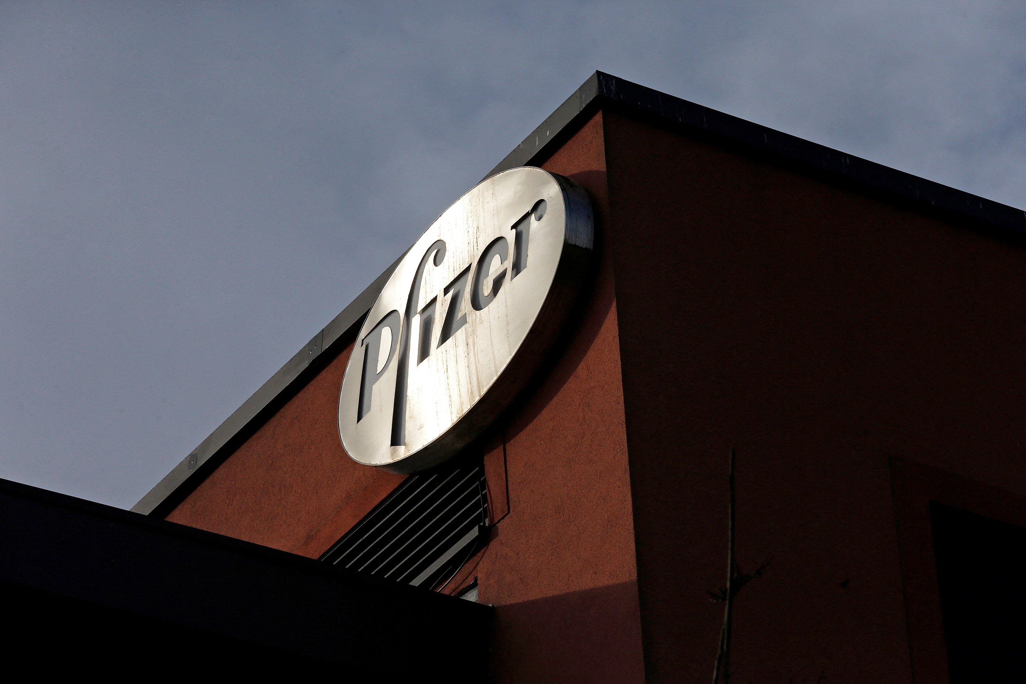 A company logo is seen at a Pfizer office in Dublin