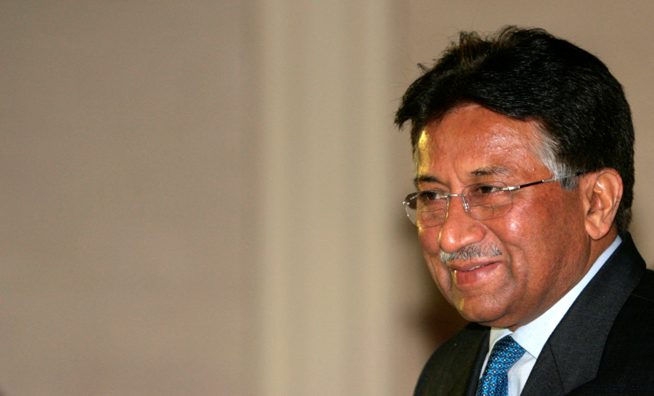 Pakistan's former President Pervez Musharraf smiles in New Delhi