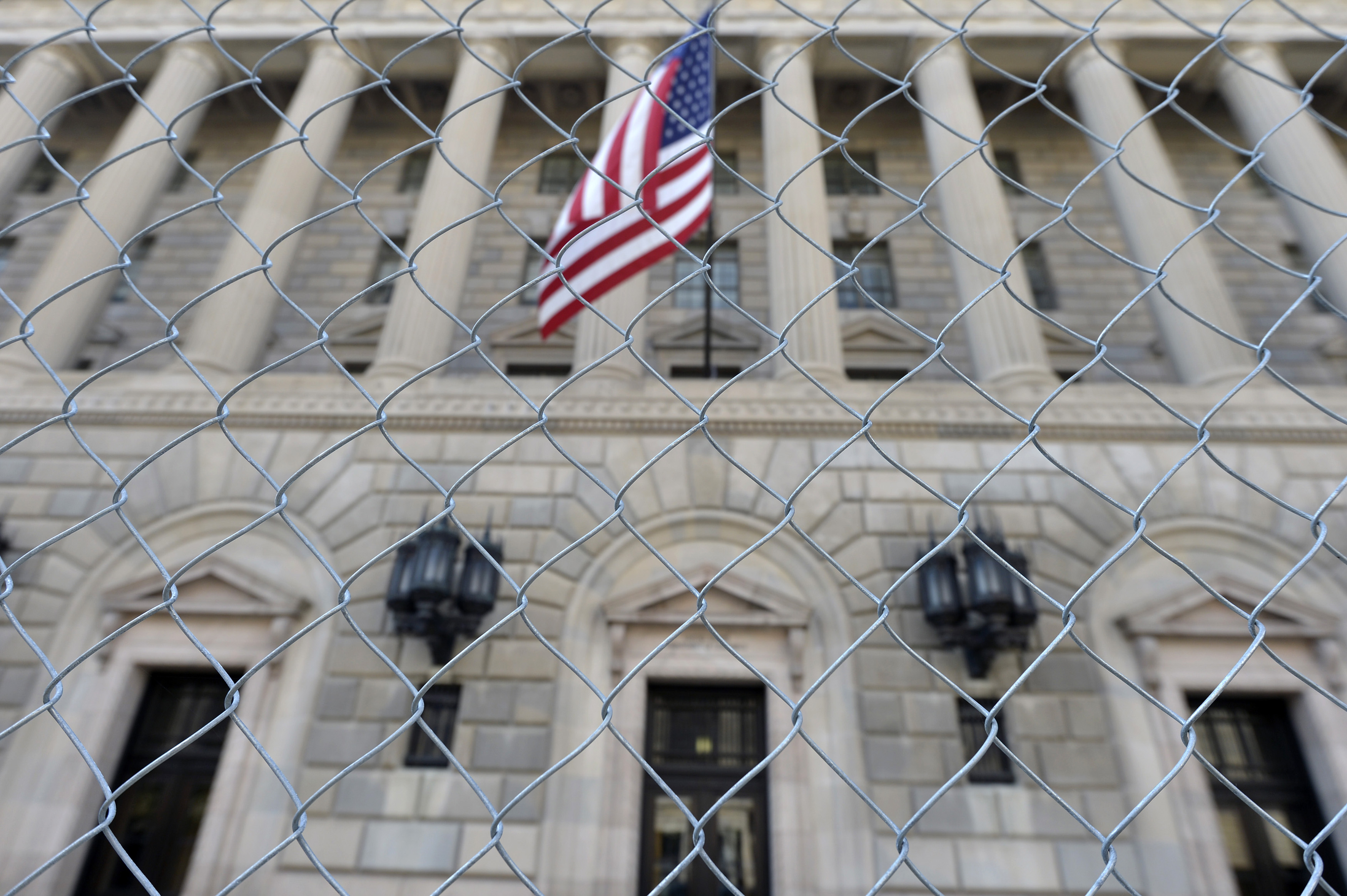 A fence surrounds the U.S. Department of Commerce in Washington