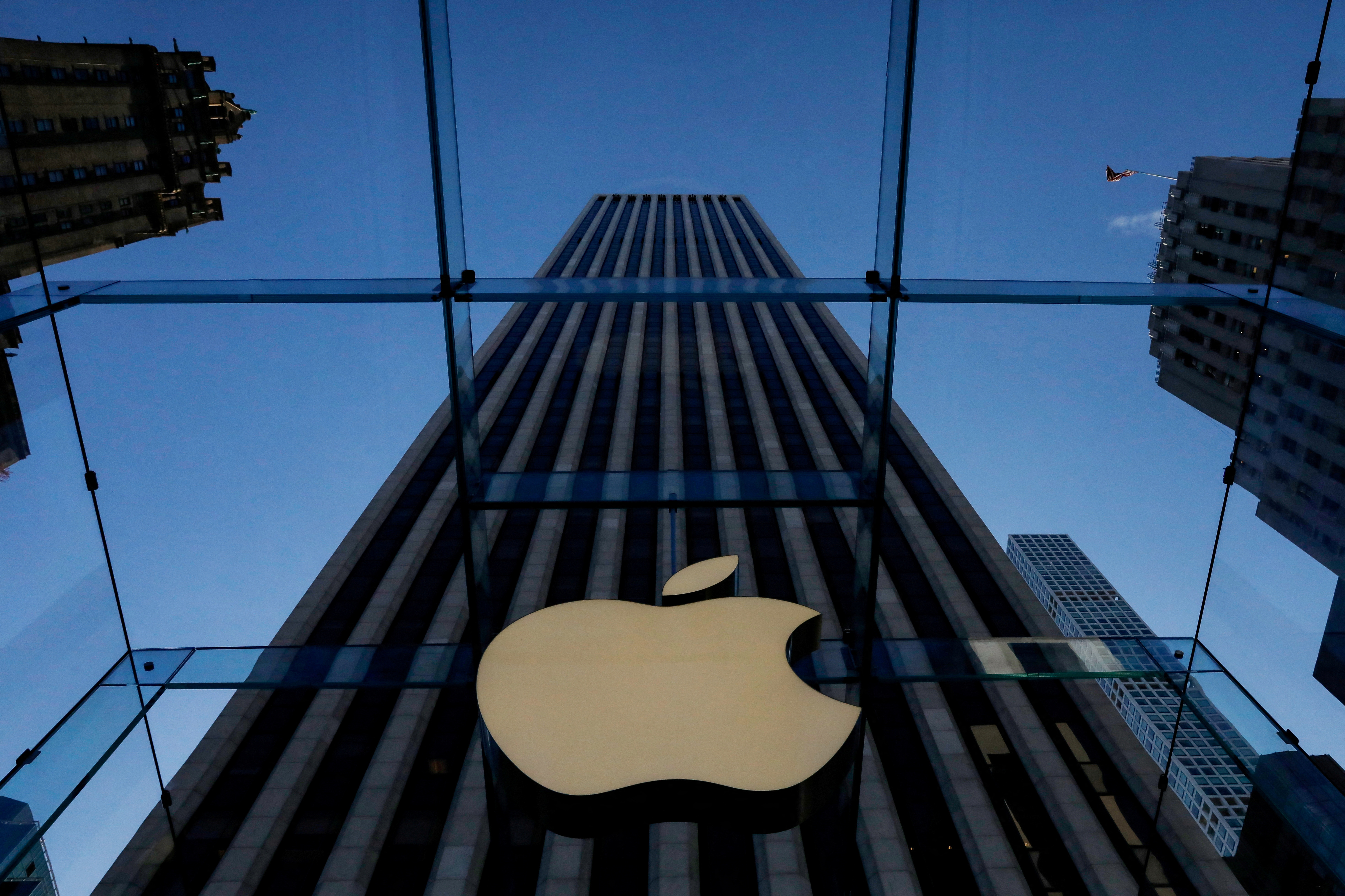 The Apple logo is seen during the preview of the redesigned and reimagined Apple Fifth Avenue store in New York