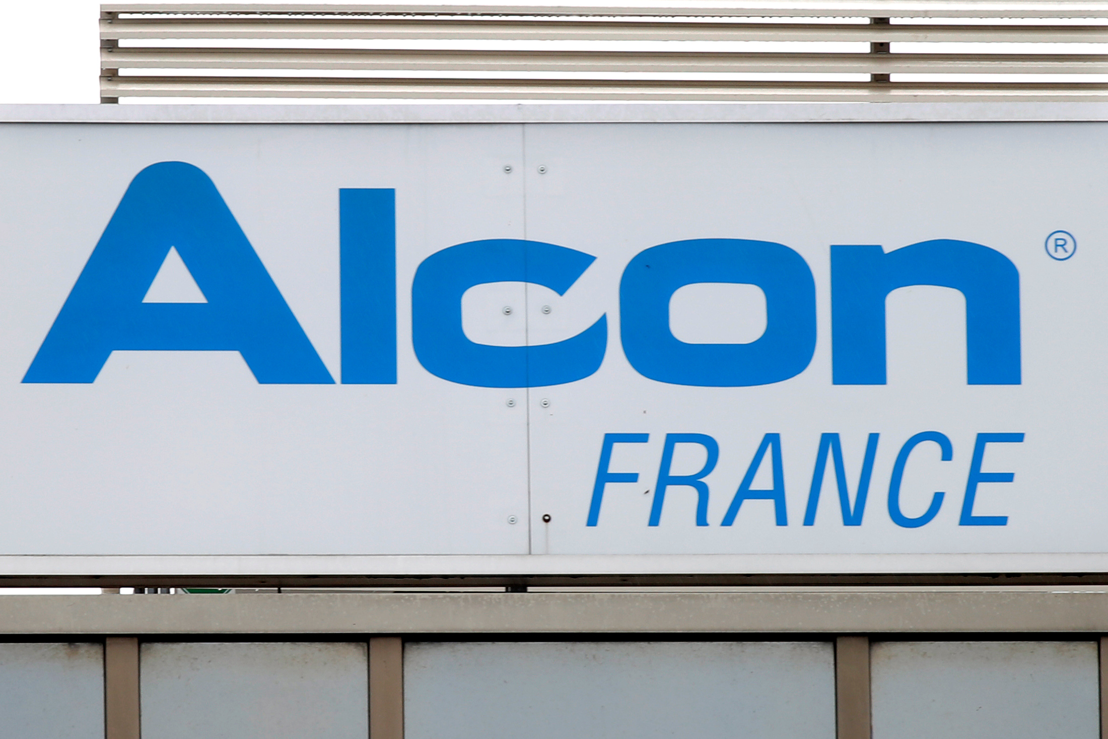 The logo of Alcon is seen at the company's French headquarters in Rueil-Malmaison
