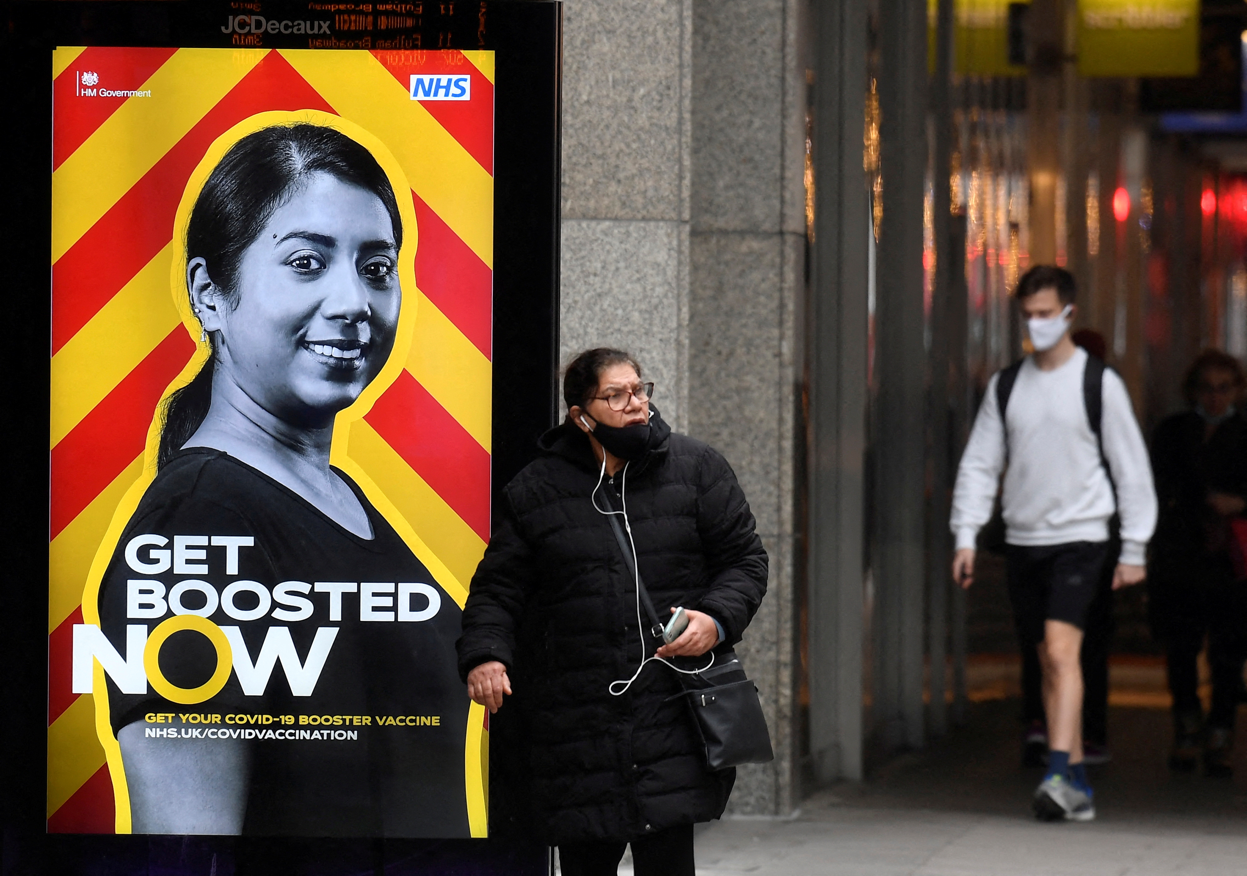 A government health campaign advertisement is seen at a bus stop, amid the spread of the coronavirus disease (COVID-19) pandemic, in London