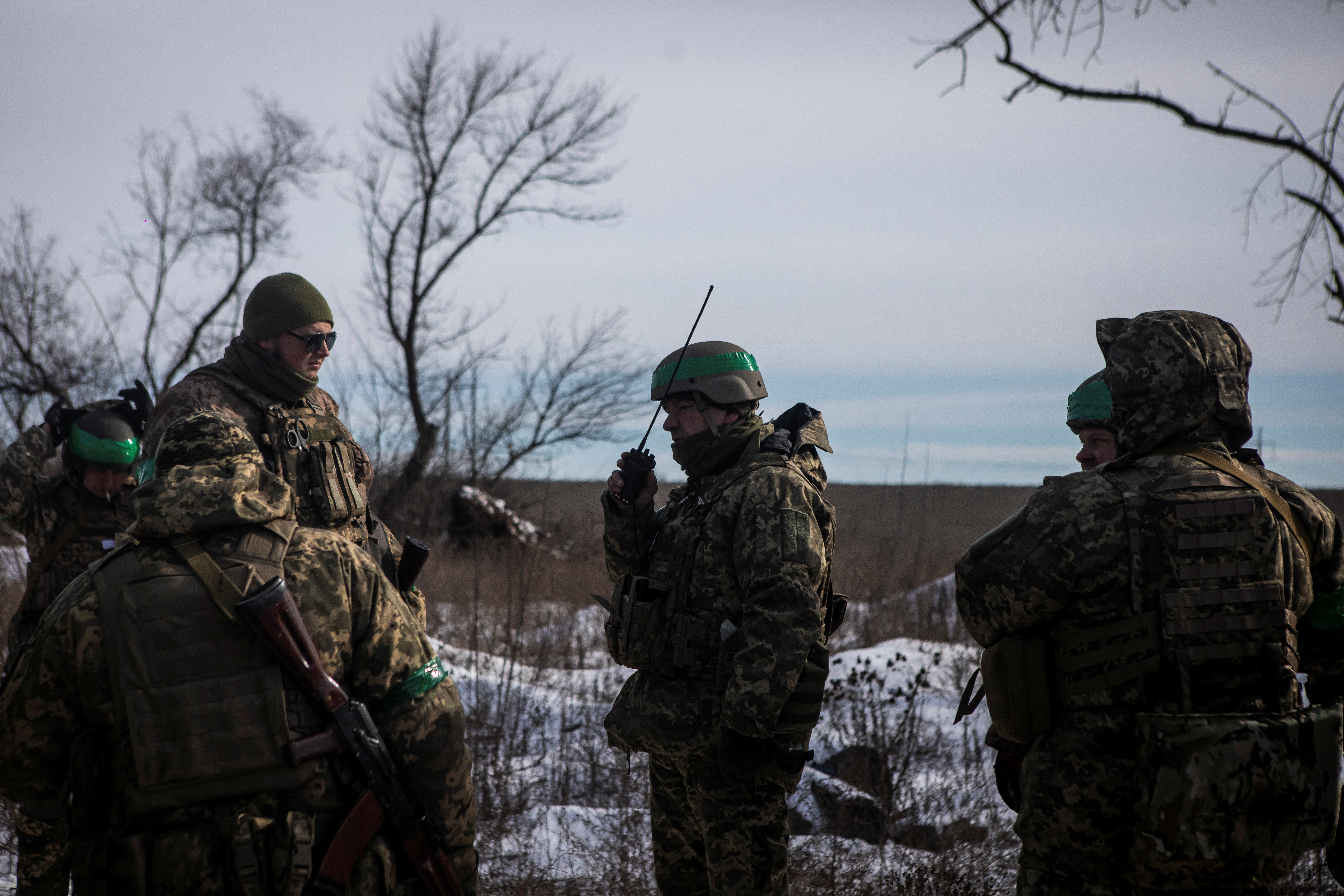 Ukrainian servicemen are seen on a road outside the frontline town of Bakhmut