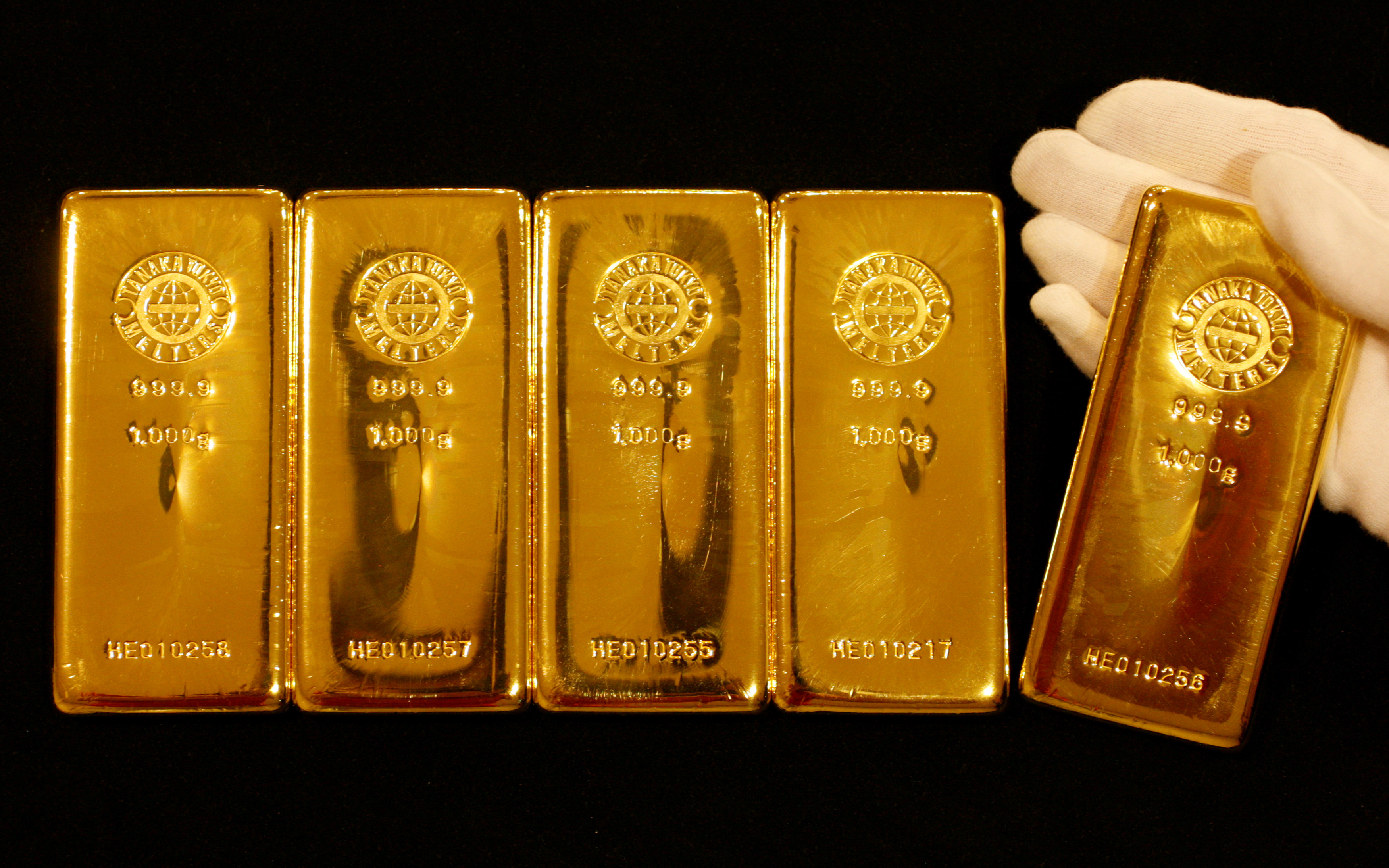 Gold bars are displayed during a photo opportunity at the Ginza Tanaka store in Tokyo