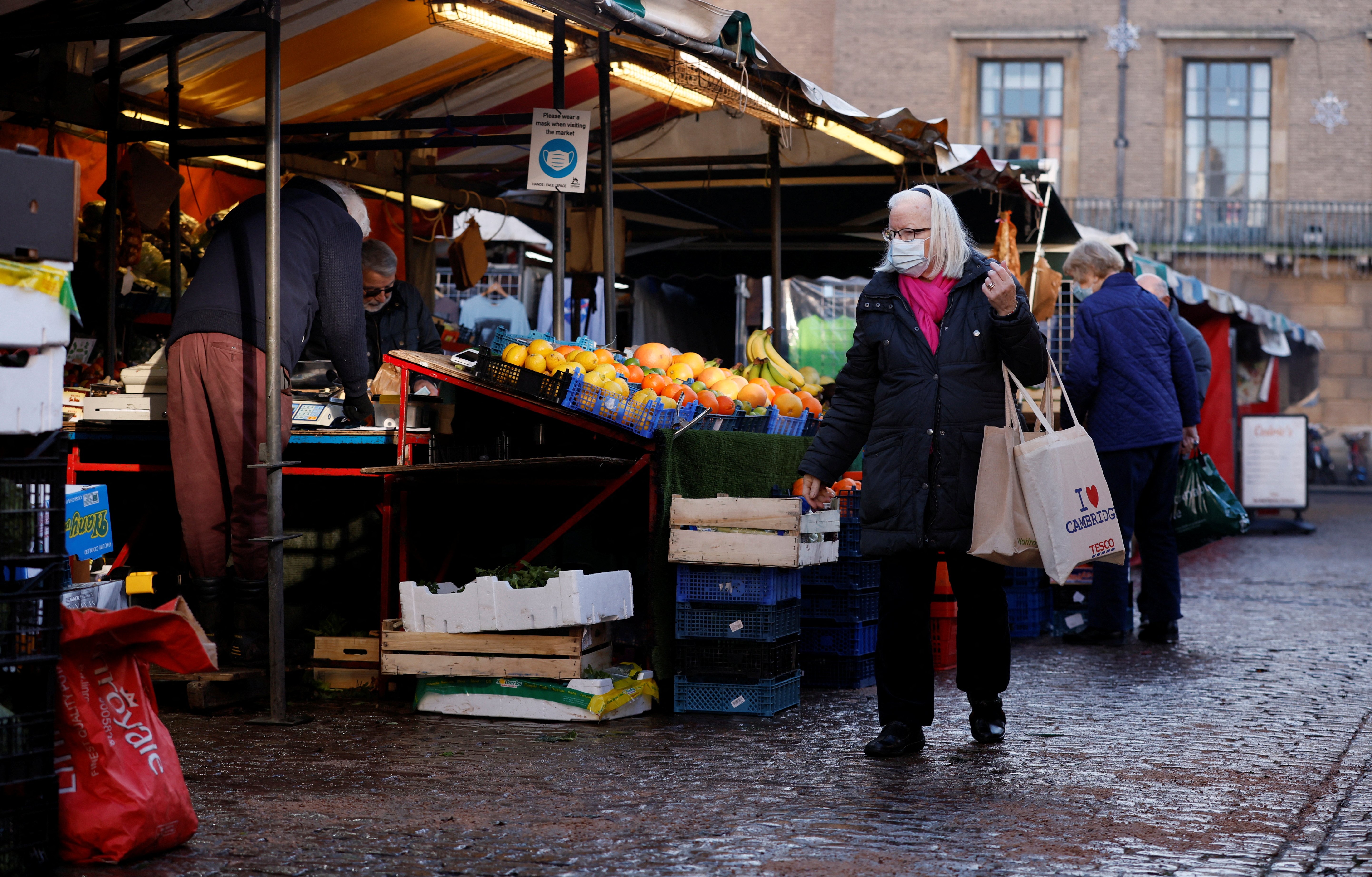 A woman wearing a face mask shops in Cambridge Market Square, amid the coronavirus disease (COVID-19) outbreak